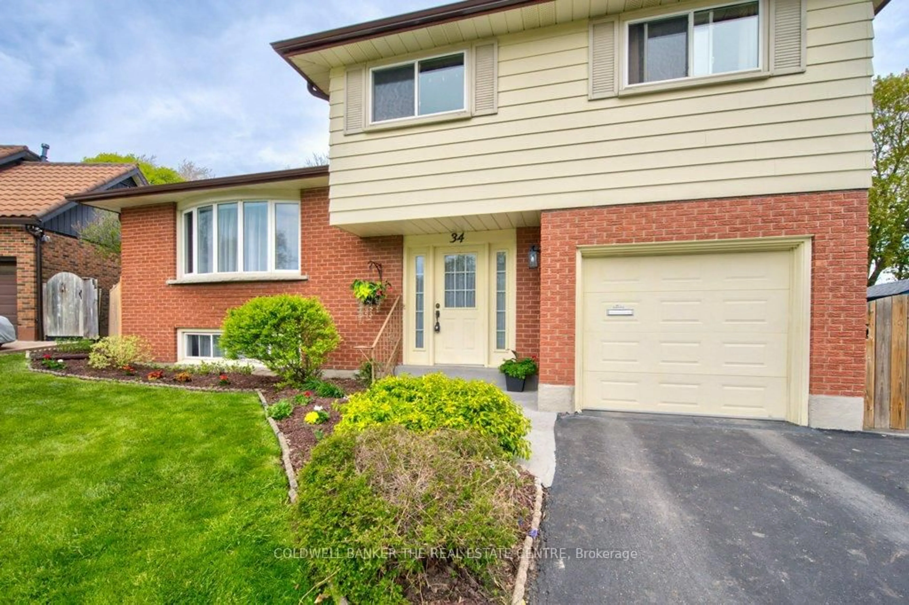 Home with brick exterior material, street for 34 Westwood Cres, Kitchener Ontario N2M 2L8