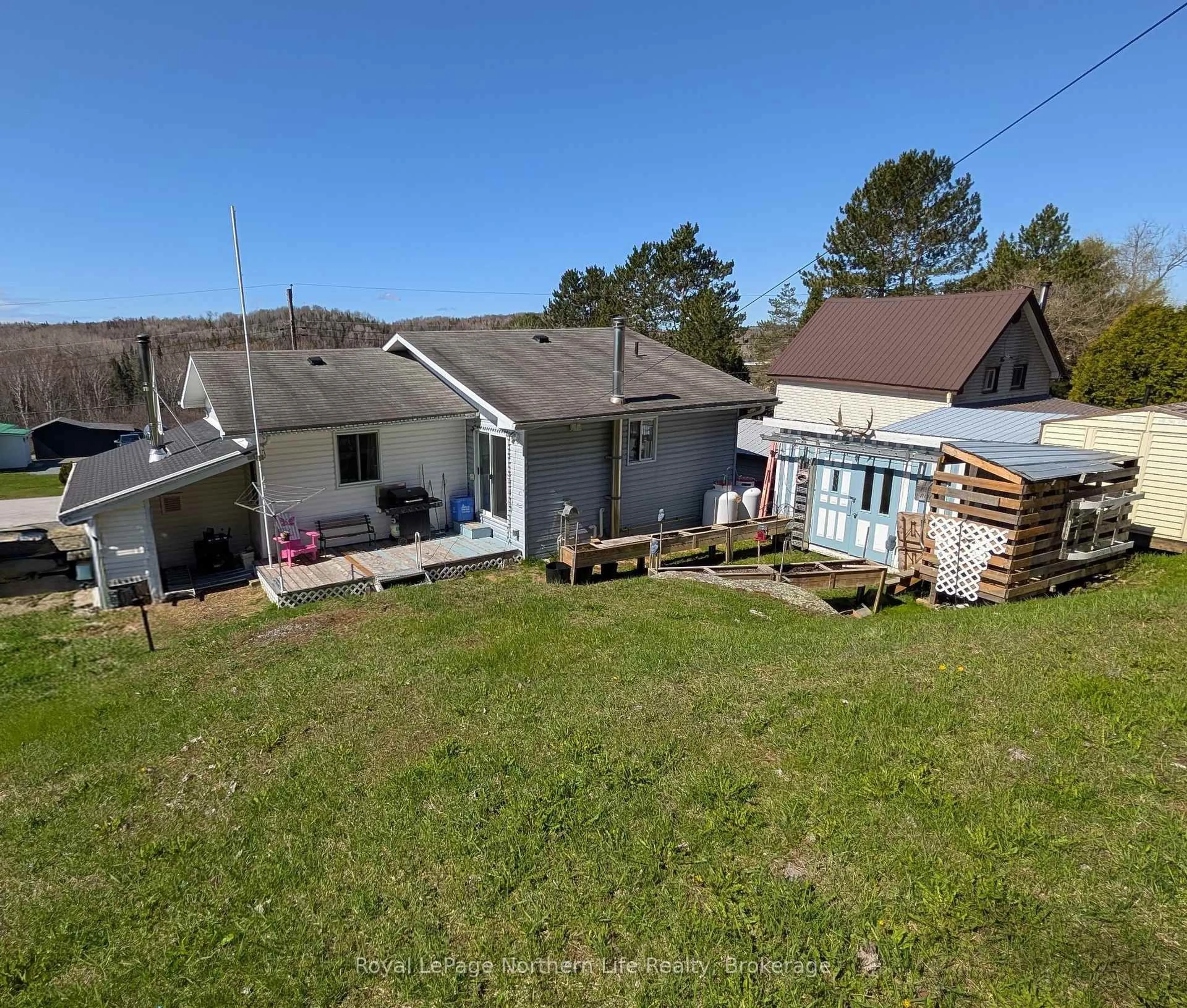 A pic from outside/outdoor area/front of a property/back of a property/a pic from drone, unknown for 141 Larocque St, West Nipissing Ontario P0H 1M0