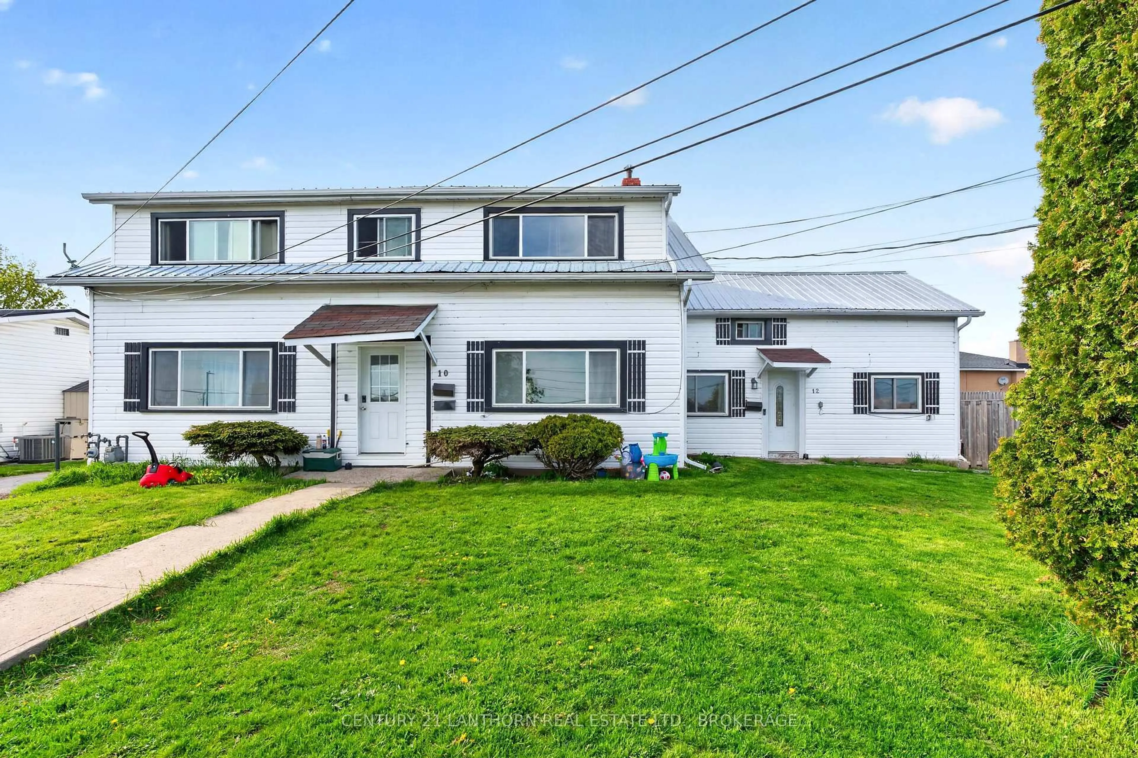 Home with vinyl exterior material, street for 10/12 Manitou Cres, Loyalist Ontario K7N 1B6