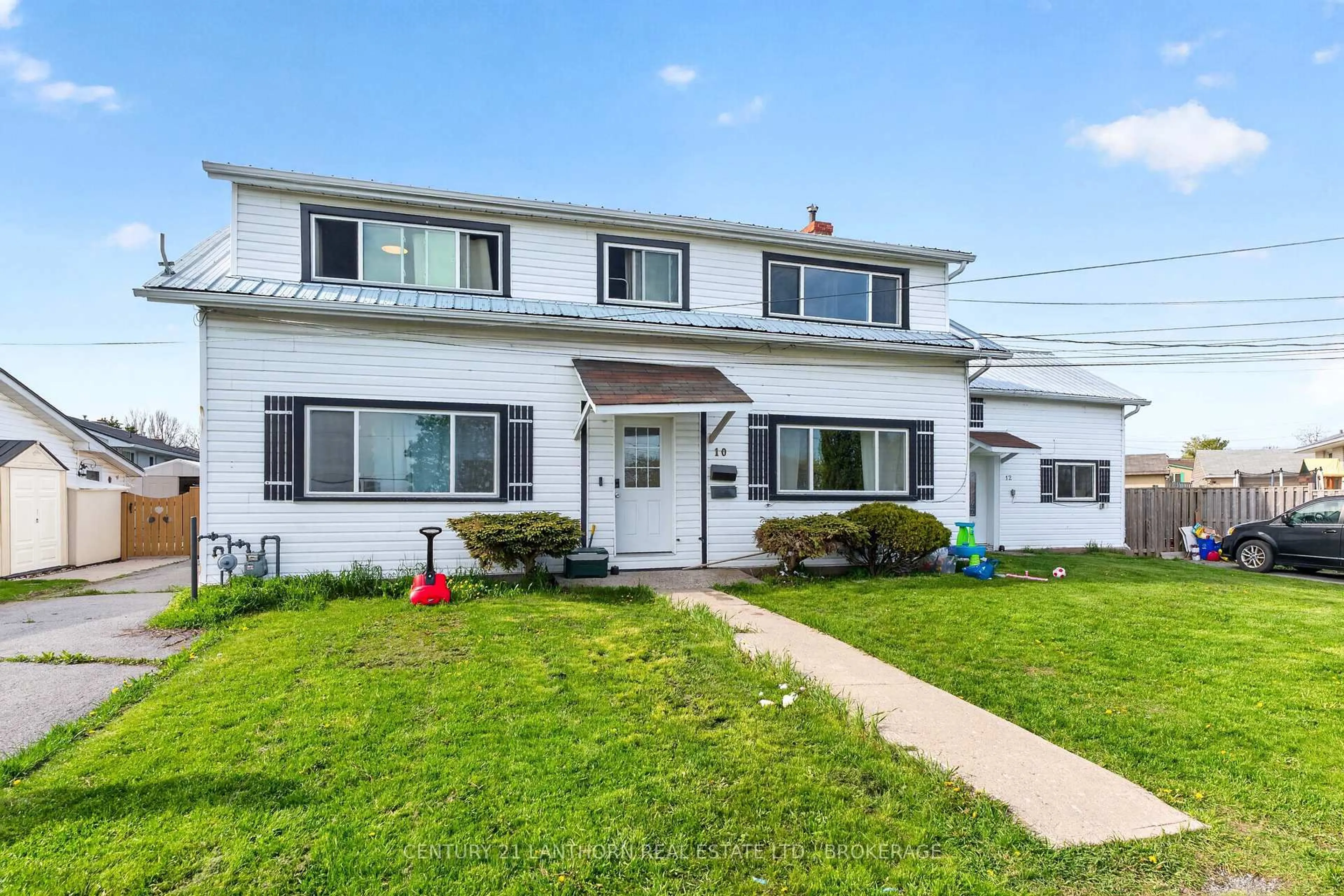 Home with vinyl exterior material, street for 10/12 Manitou Cres, Loyalist Ontario K7N 1B6