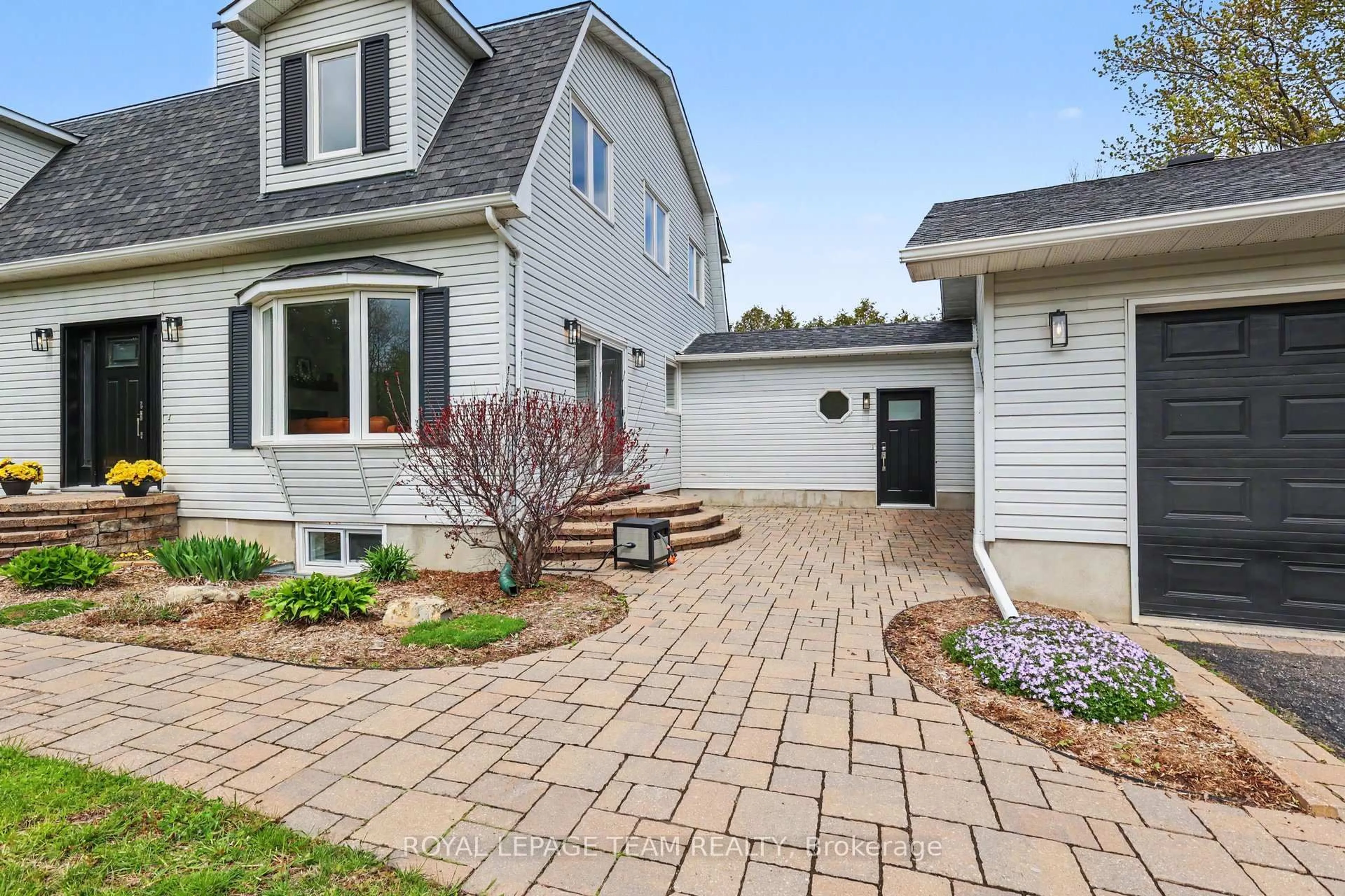 Home with brick exterior material, street for 8471 Marionville Rd, Winchester Ontario K0C 2K0