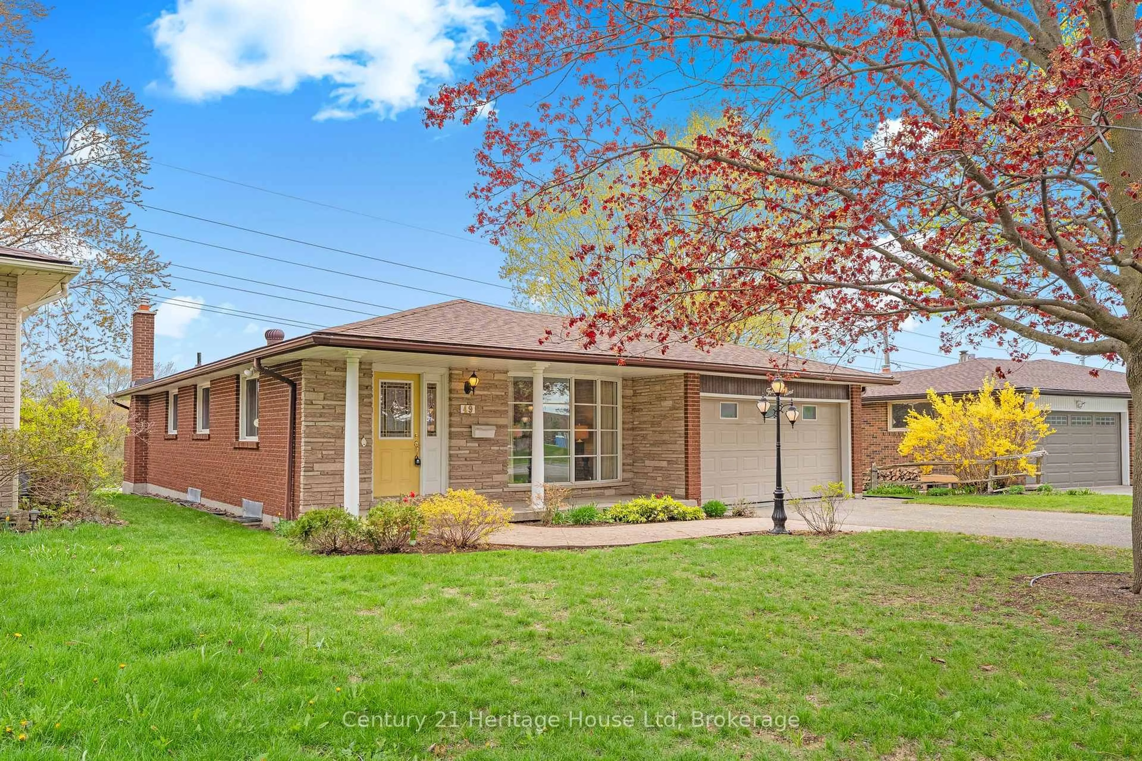 Home with brick exterior material, street for 49 Vanier Dr, Guelph Ontario N1G 2K9