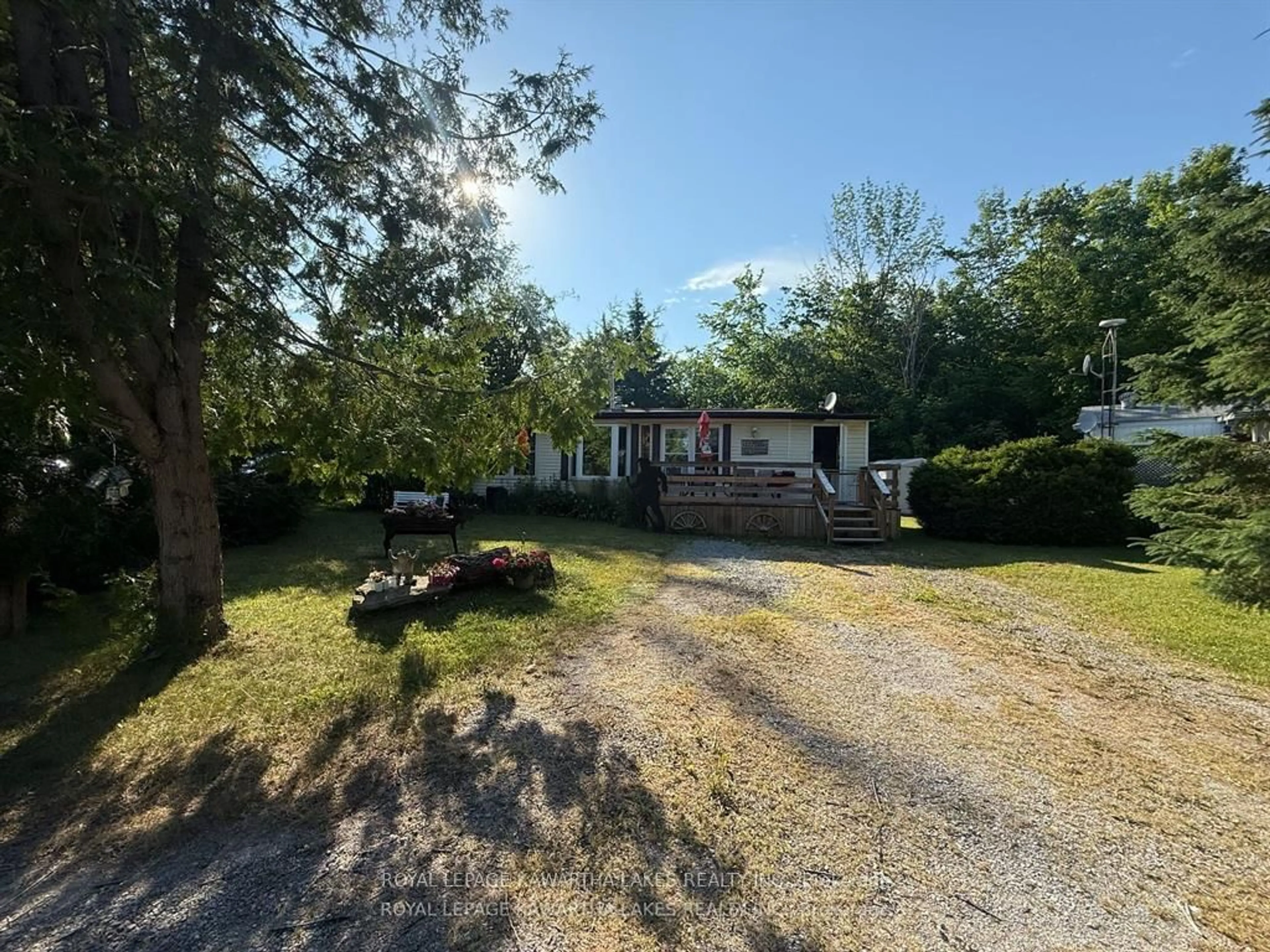 A pic from outside/outdoor area/front of a property/back of a property/a pic from drone, unknown for 1802 County Road 121 Rd #Unit 303, Kawartha Lakes Ontario K0M 1N0