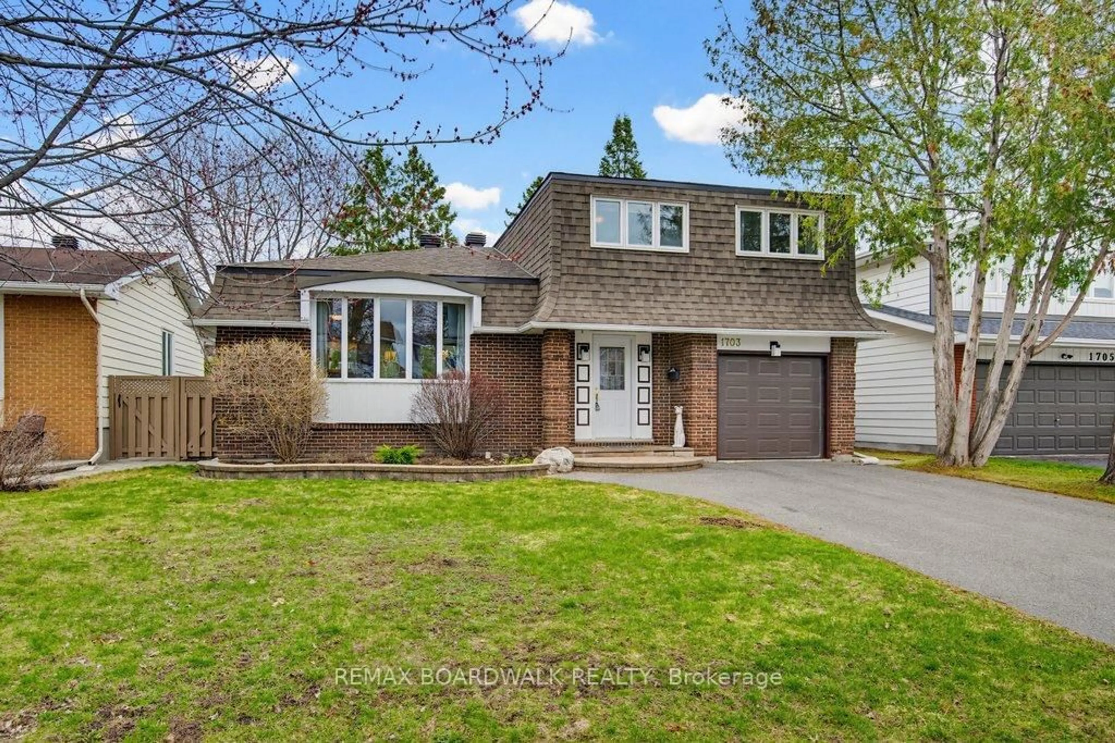 Home with brick exterior material, street for 1703 Fieldstone Cres, Ottawa Ontario K1C 1R6