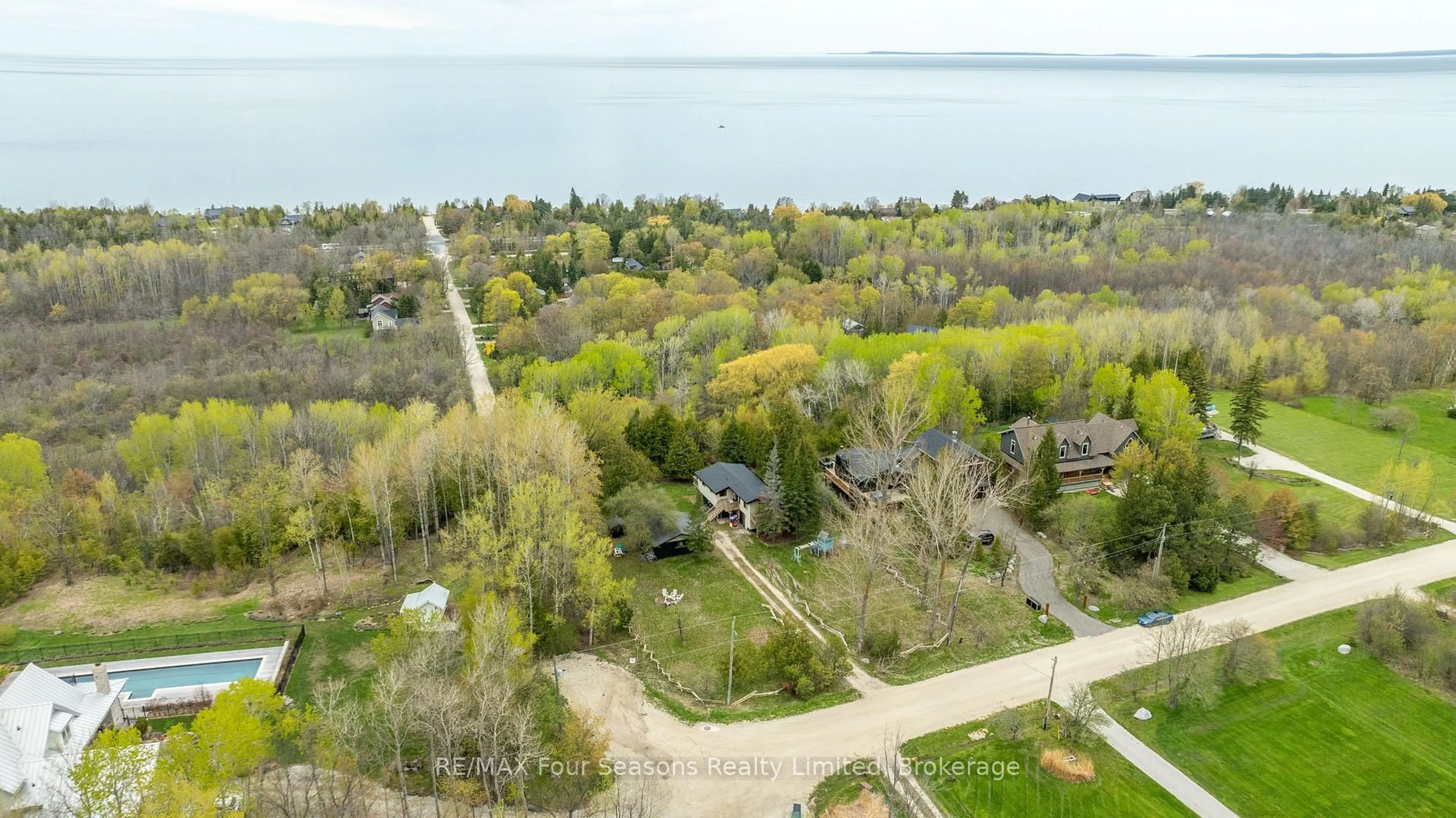 A pic from outside/outdoor area/front of a property/back of a property/a pic from drone, water/lake/river/ocean view for 220 Hidden Lake Rd, Blue Mountains Ontario L9Y 0T6