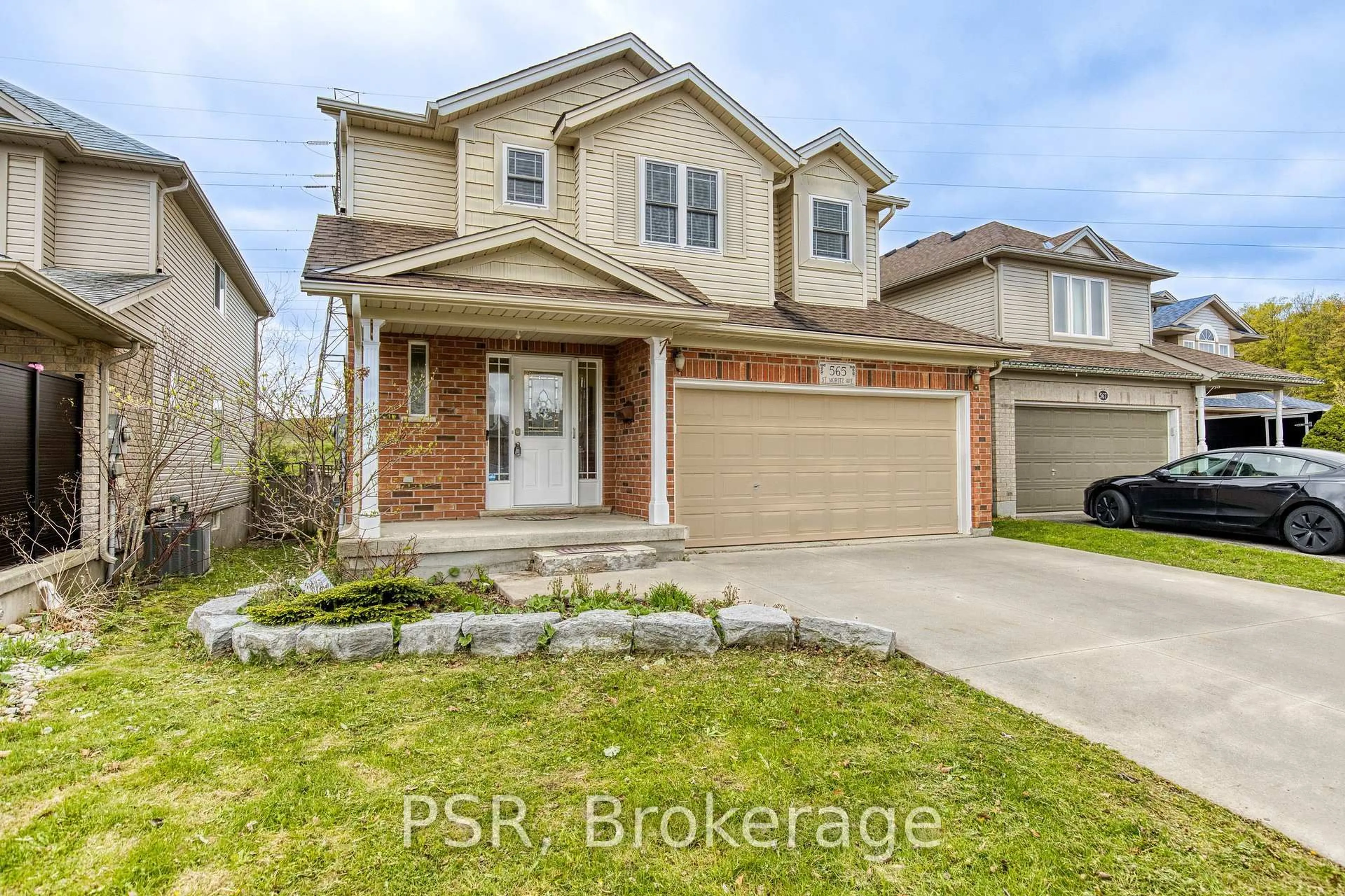 Home with brick exterior material, street for 565 St Moritz Ave, Waterloo Ontario N2T 2Z3