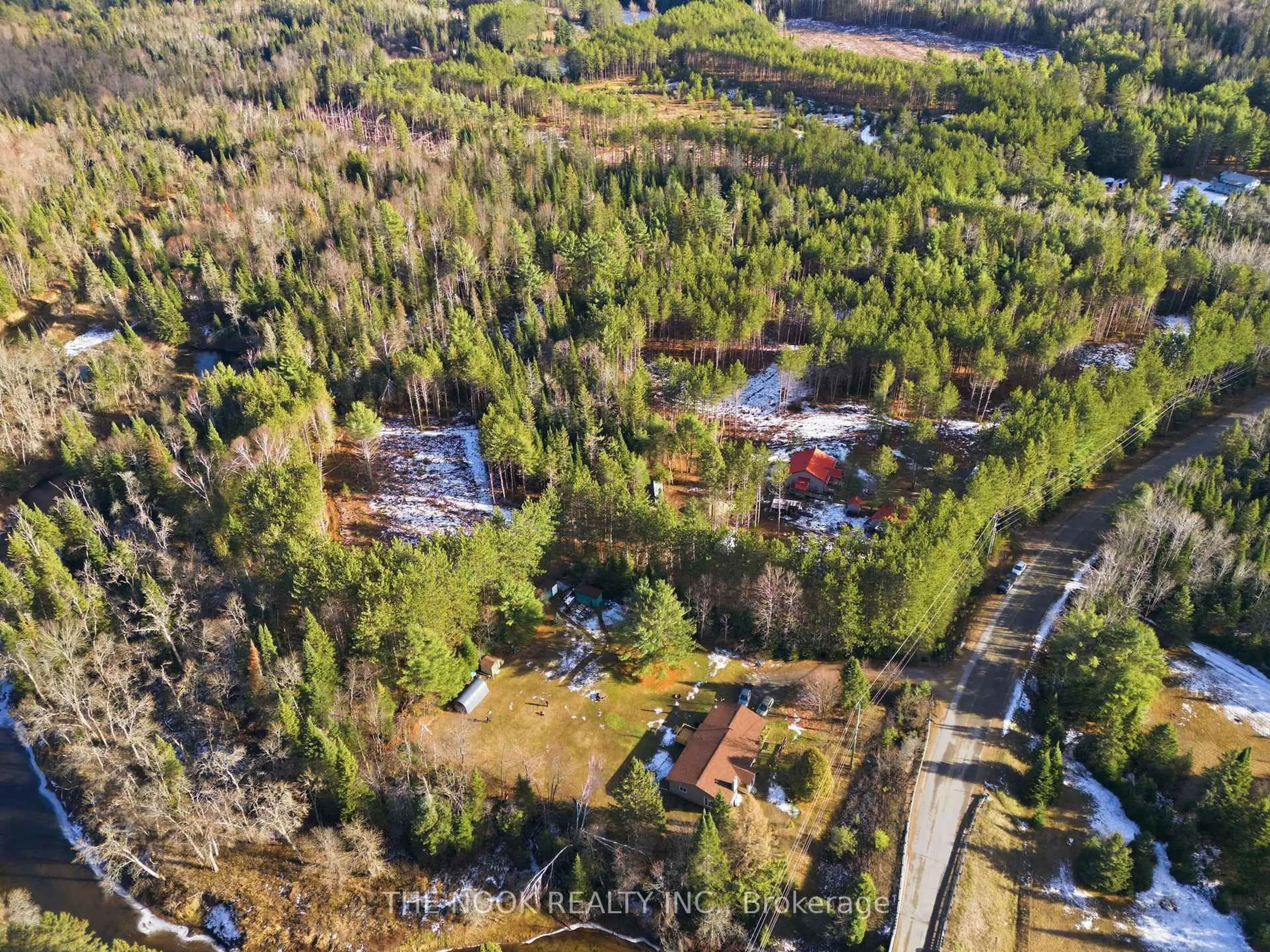 A pic from outside/outdoor area/front of a property/back of a property/a pic from drone, forest/trees view for 1055 Irondale Rd, Minden Hills Ontario K0M 2A1
