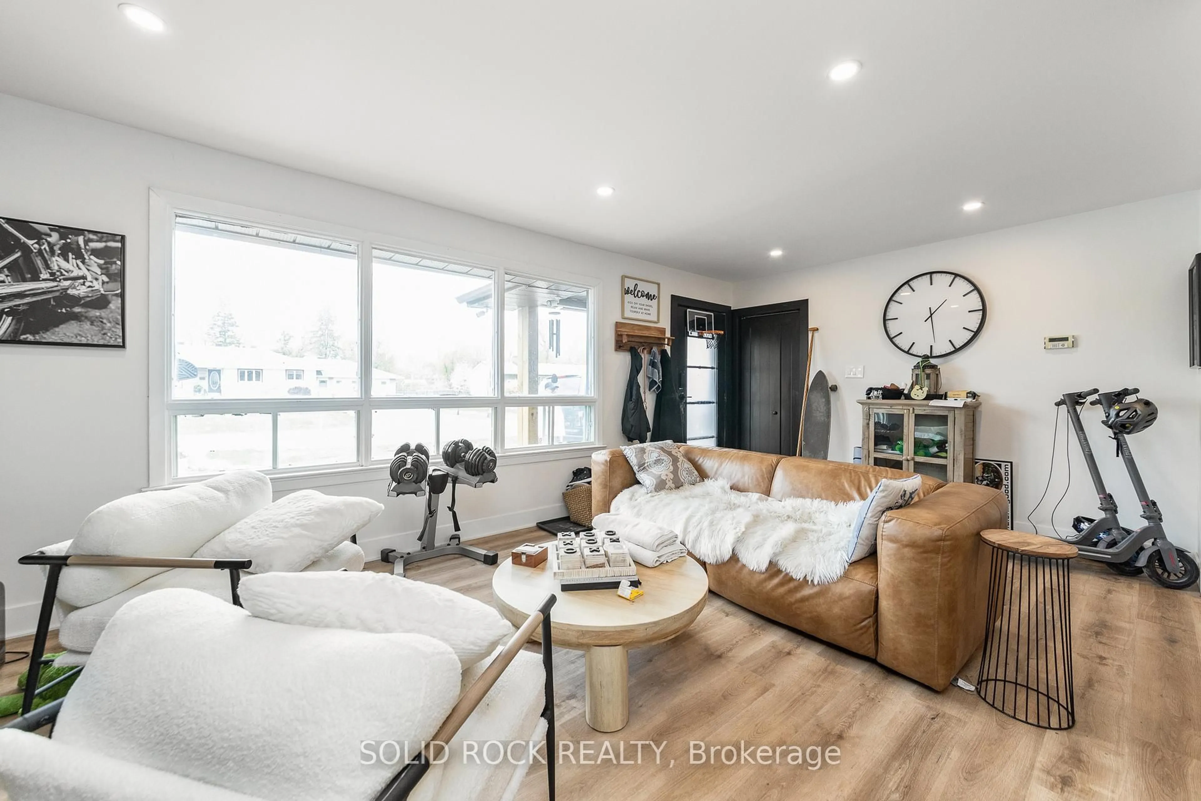 Living room with furniture, wood/laminate floor for 20 Norway Spruce St, Ottawa Ontario K2S 1P3