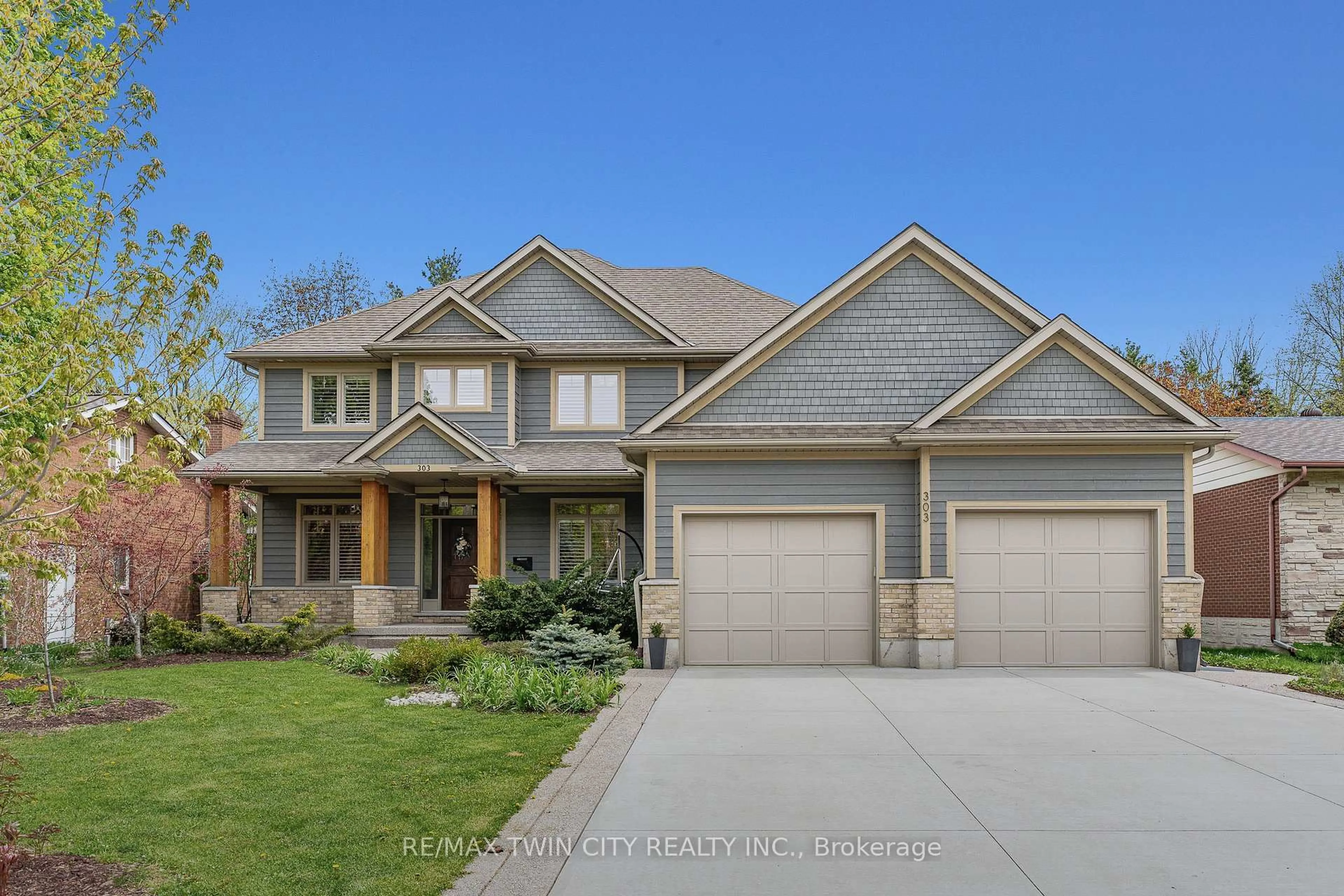 Home with brick exterior material, street for 303 Castlefield Ave, Waterloo Ontario N2K 2M4