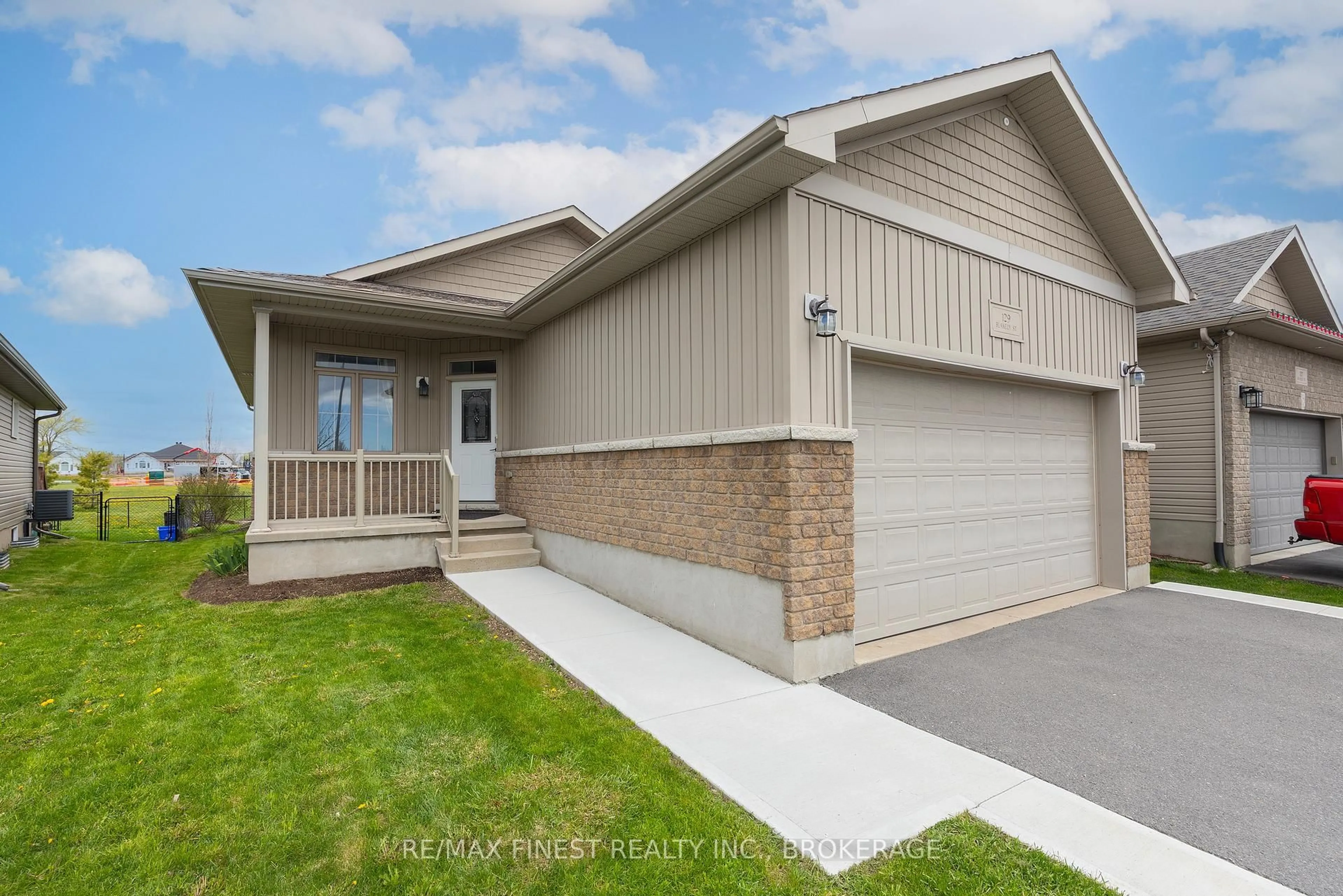 Home with vinyl exterior material, street for 129 Blakely St, Loyalist Ontario K7N 0B1