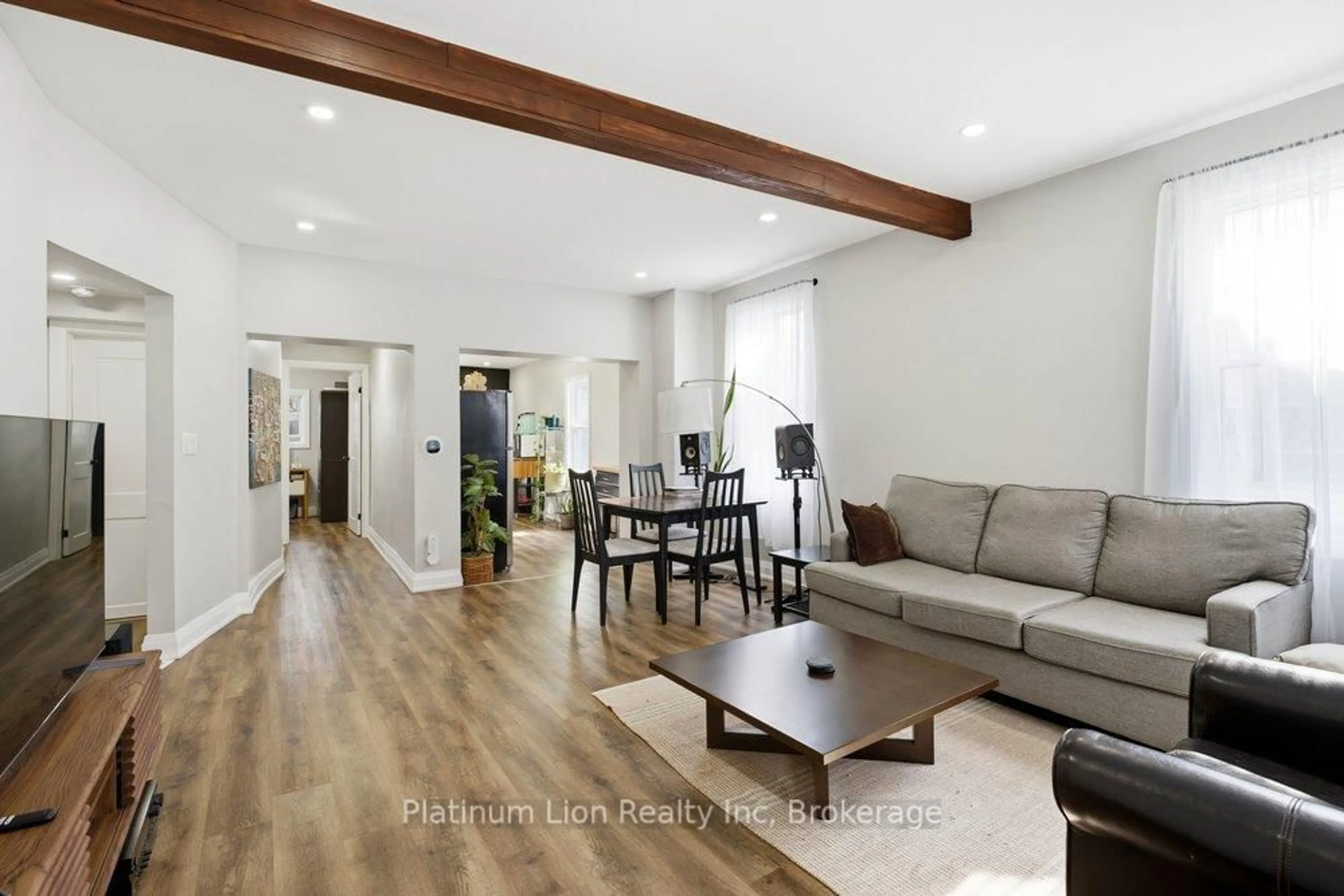Living room with furniture, wood/laminate floor for 773 Lawrence Rd, Hamilton Ontario L8K 1Z7