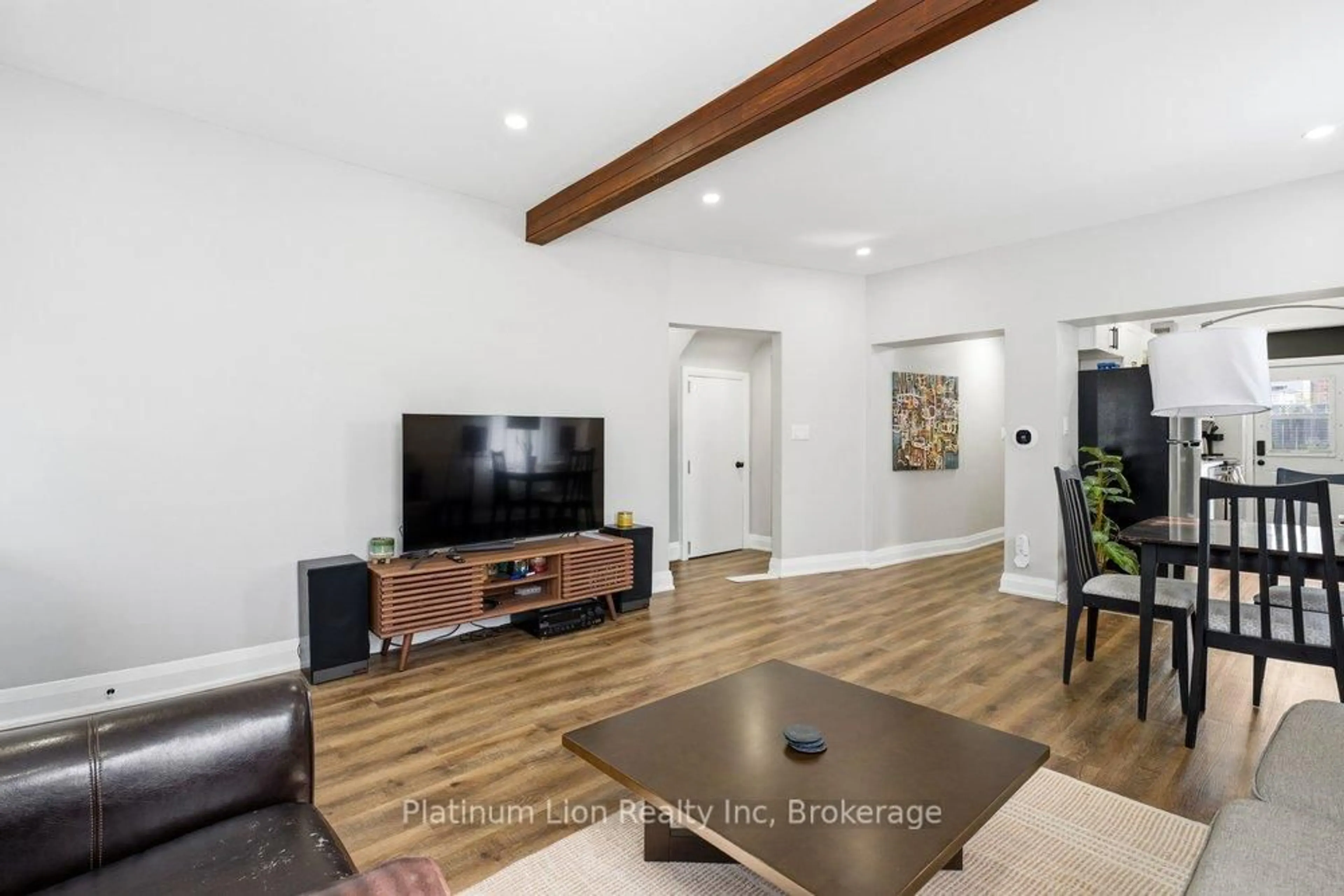 Living room with furniture, wood/laminate floor for 773 Lawrence Rd, Hamilton Ontario L8K 1Z7