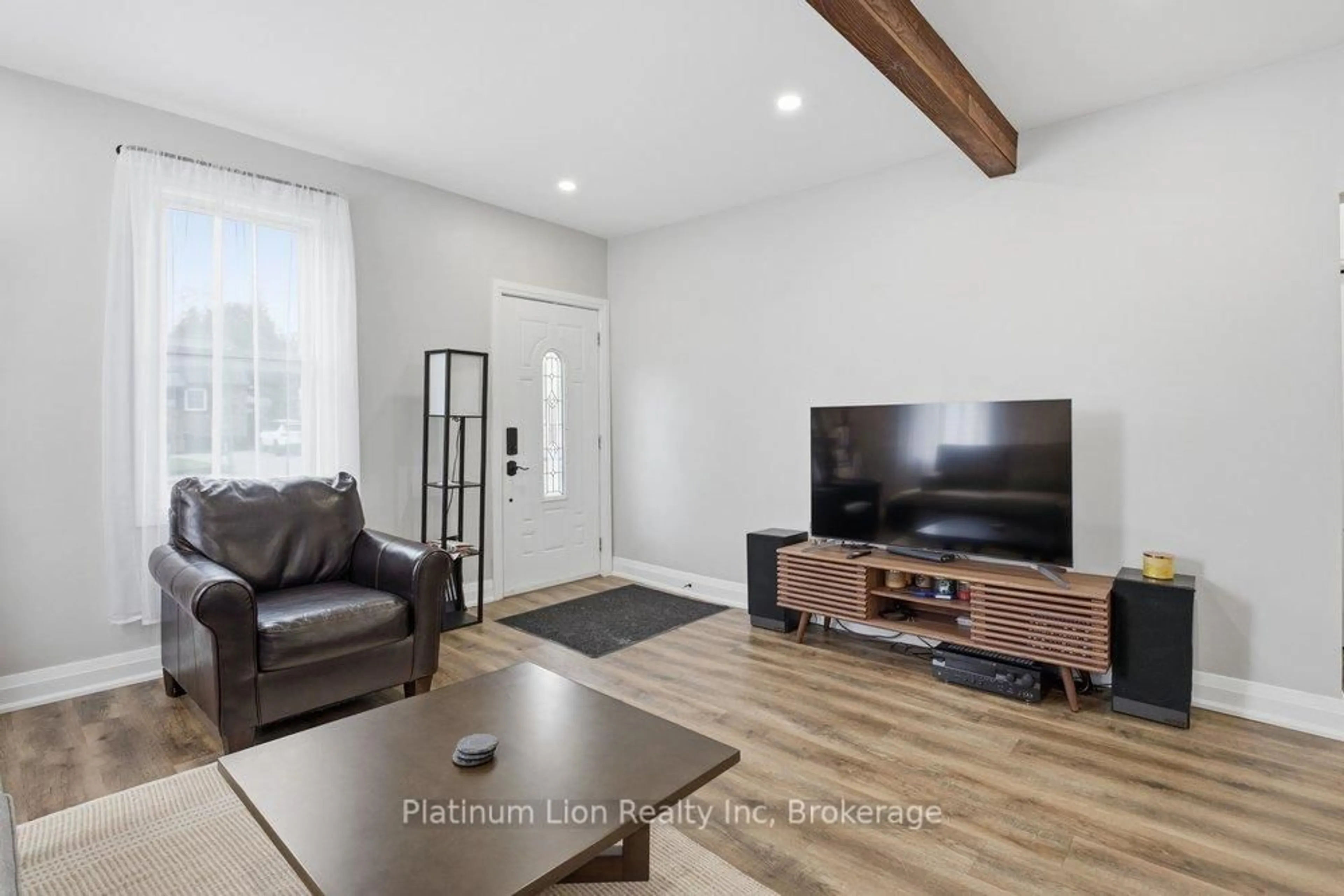Living room with furniture, wood/laminate floor for 773 Lawrence Rd, Hamilton Ontario L8K 1Z7