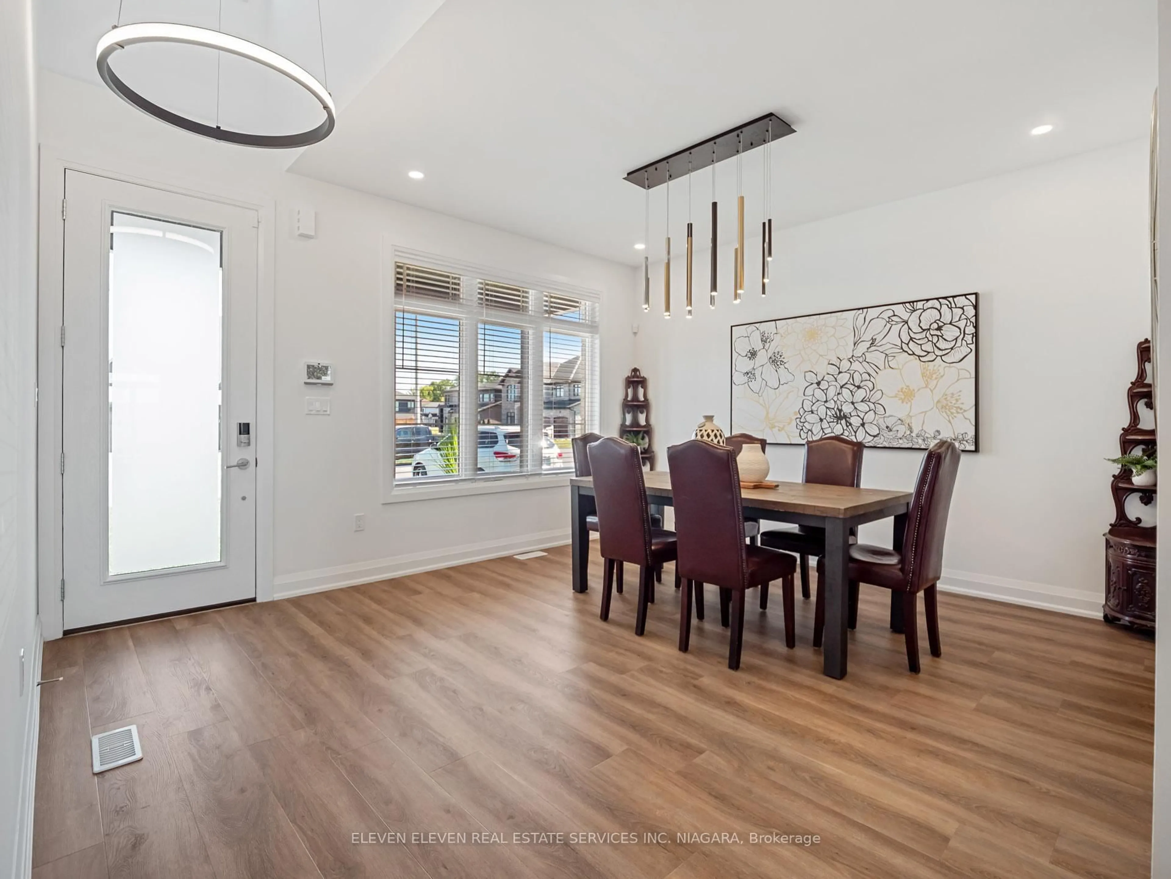 Dining room, wood/laminate floor for 7483 Sherrilee Cres, Niagara Falls Ontario L2H 3T4