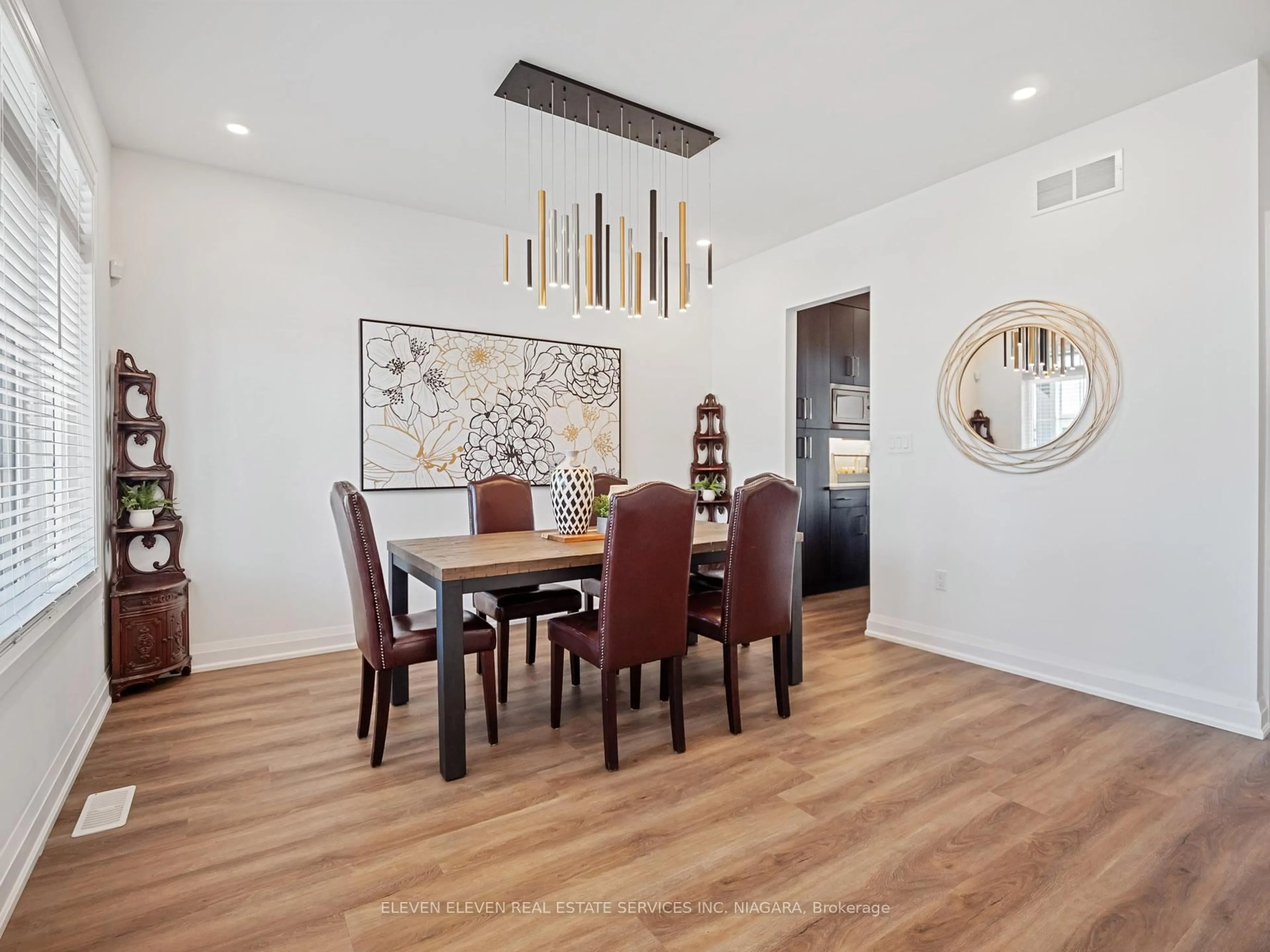 Dining room, wood/laminate floor for 7483 Sherrilee Cres, Niagara Falls Ontario L2H 3T4