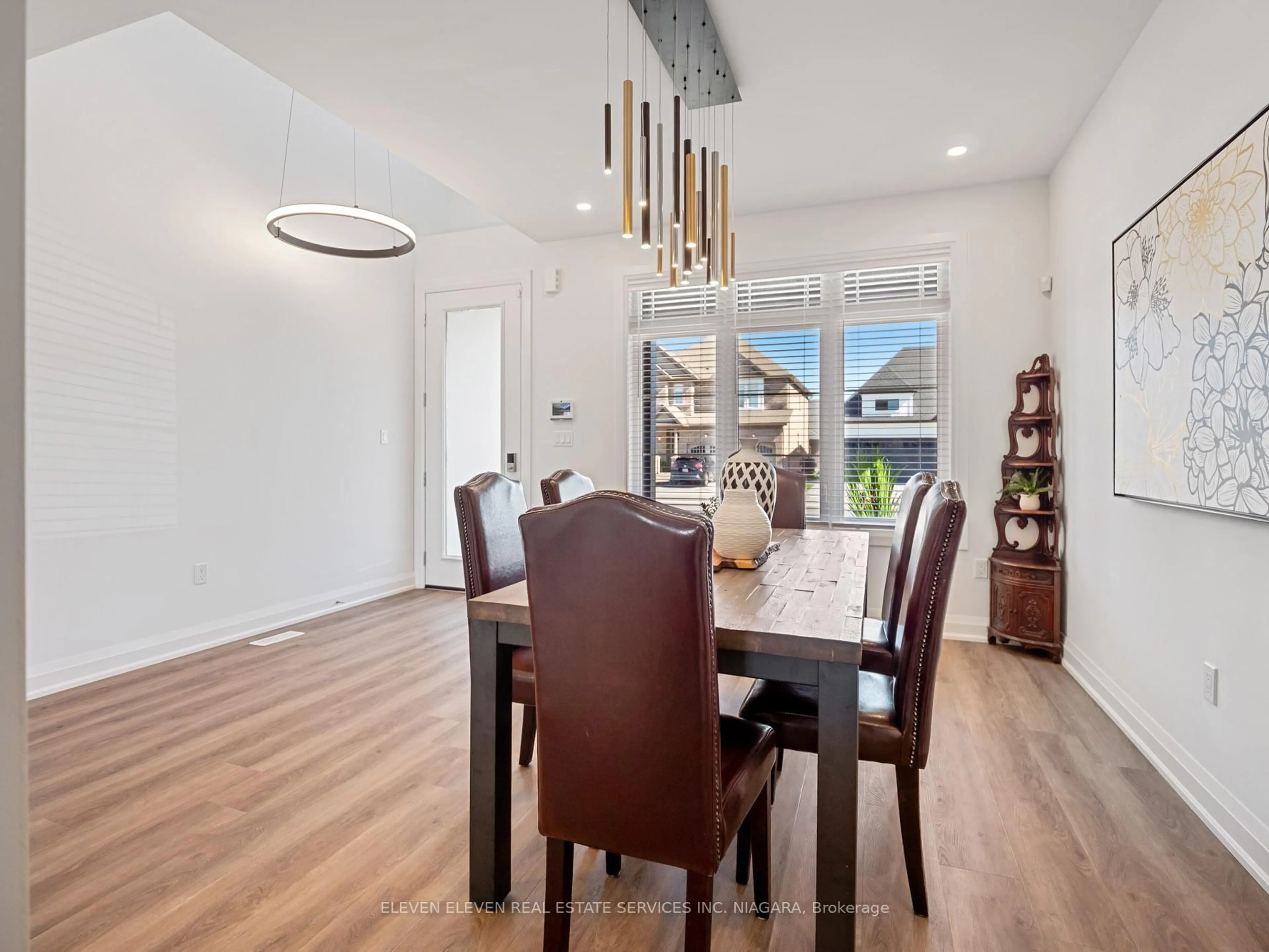 Dining room, wood/laminate floor for 7483 Sherrilee Cres, Niagara Falls Ontario L2H 3T4