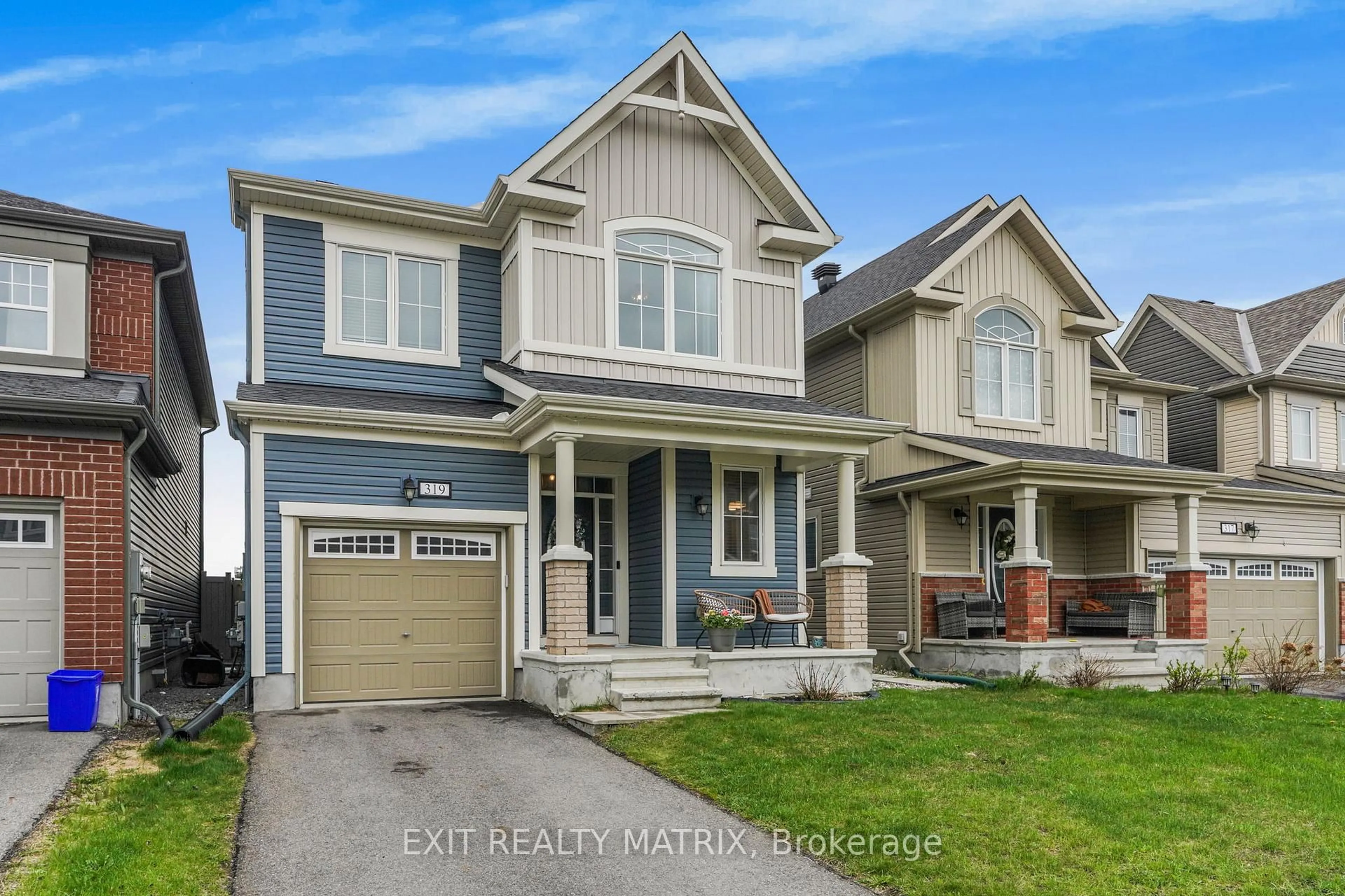Home with vinyl exterior material, street for 319 Sweetclover Way, Ottawa Ontario K4A 1E5