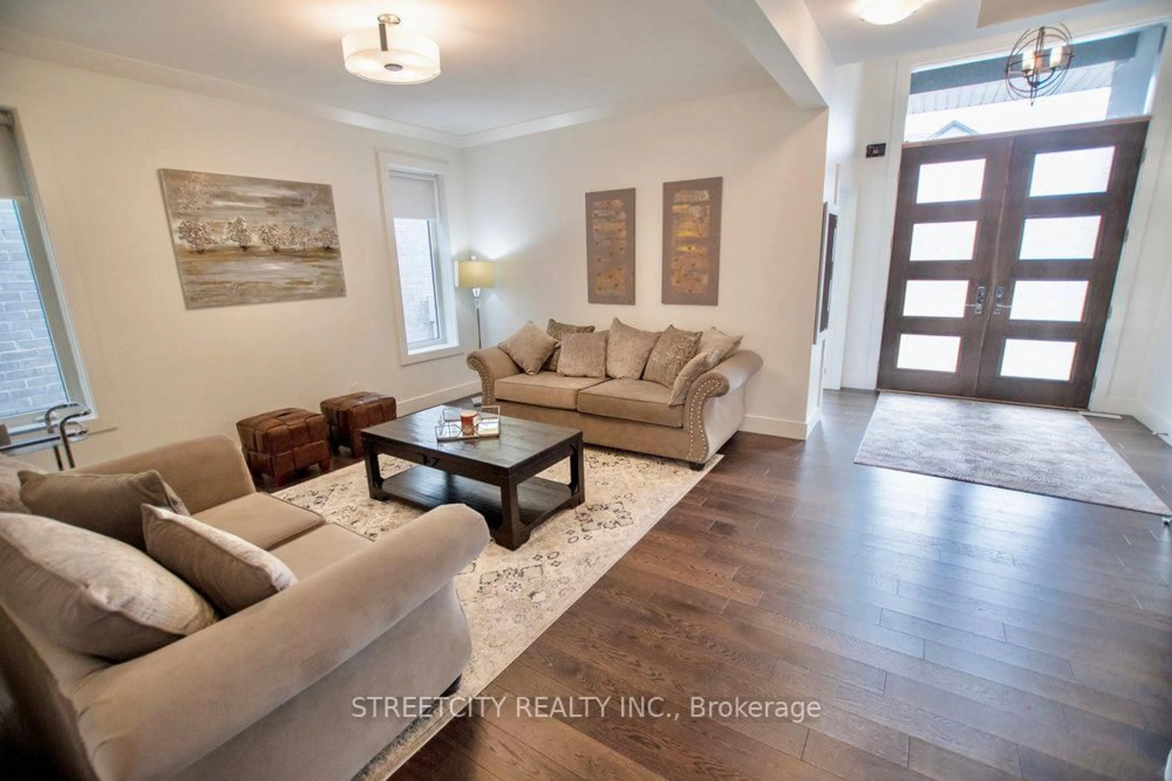Living room with furniture, wood/laminate floor for 1345 Dyer Cres, London North Ontario N6G 0S7
