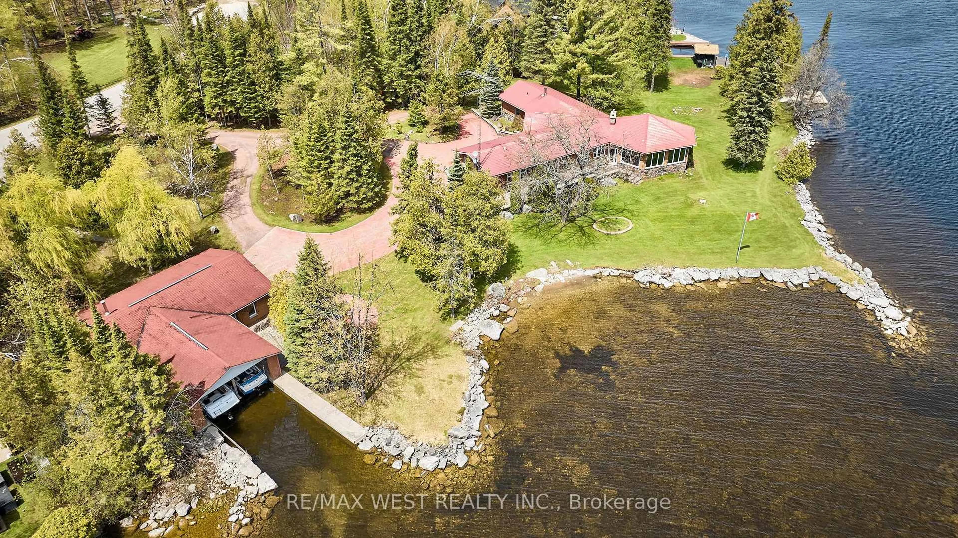 A pic from outside/outdoor area/front of a property/back of a property/a pic from drone, water/lake/river/ocean view for 557 Riverside Dr, Trent Lakes Ontario K9J 3Y9