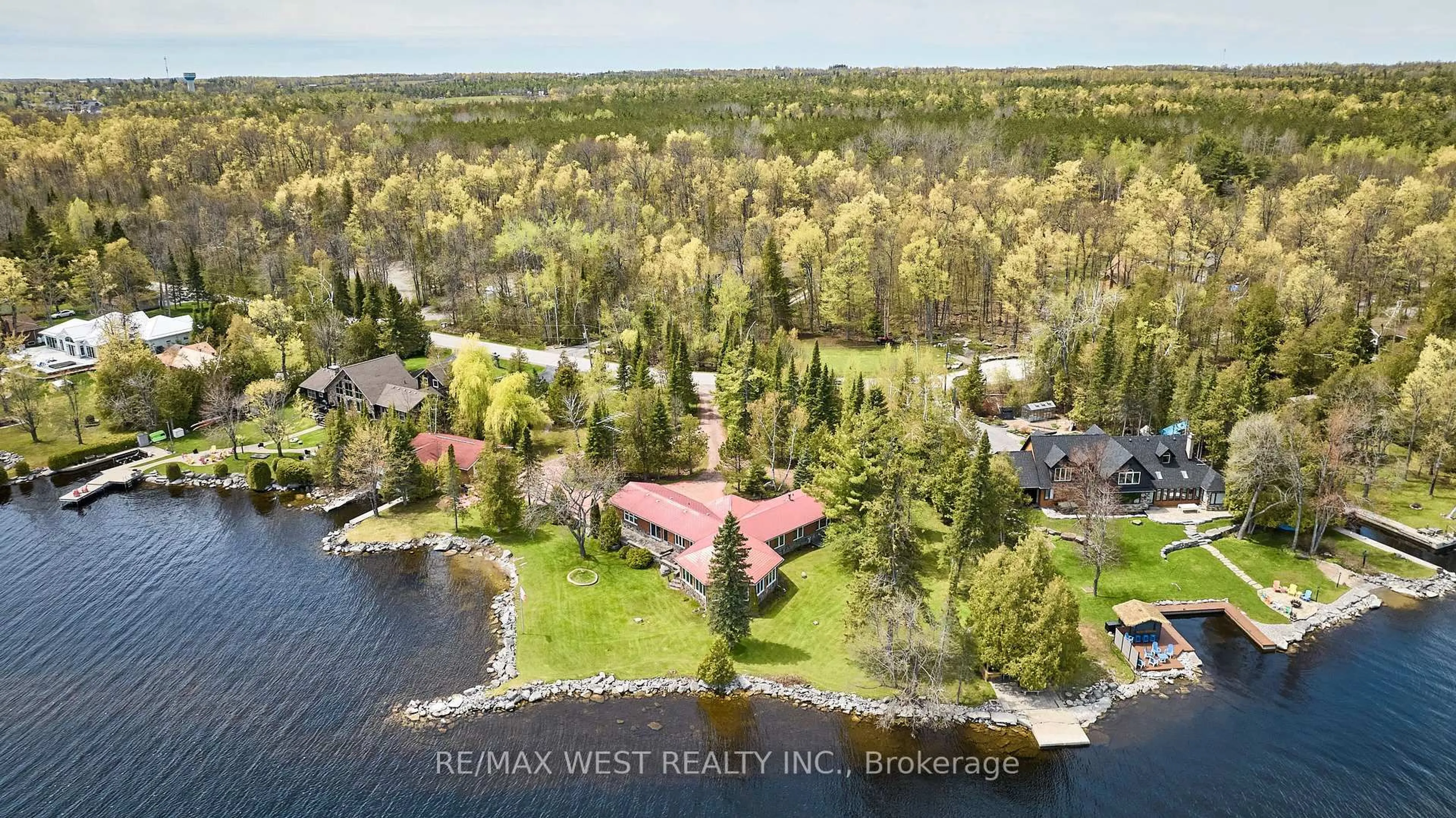 A pic from outside/outdoor area/front of a property/back of a property/a pic from drone, water/lake/river/ocean view for 557 Riverside Dr, Trent Lakes Ontario K9J 3Y9