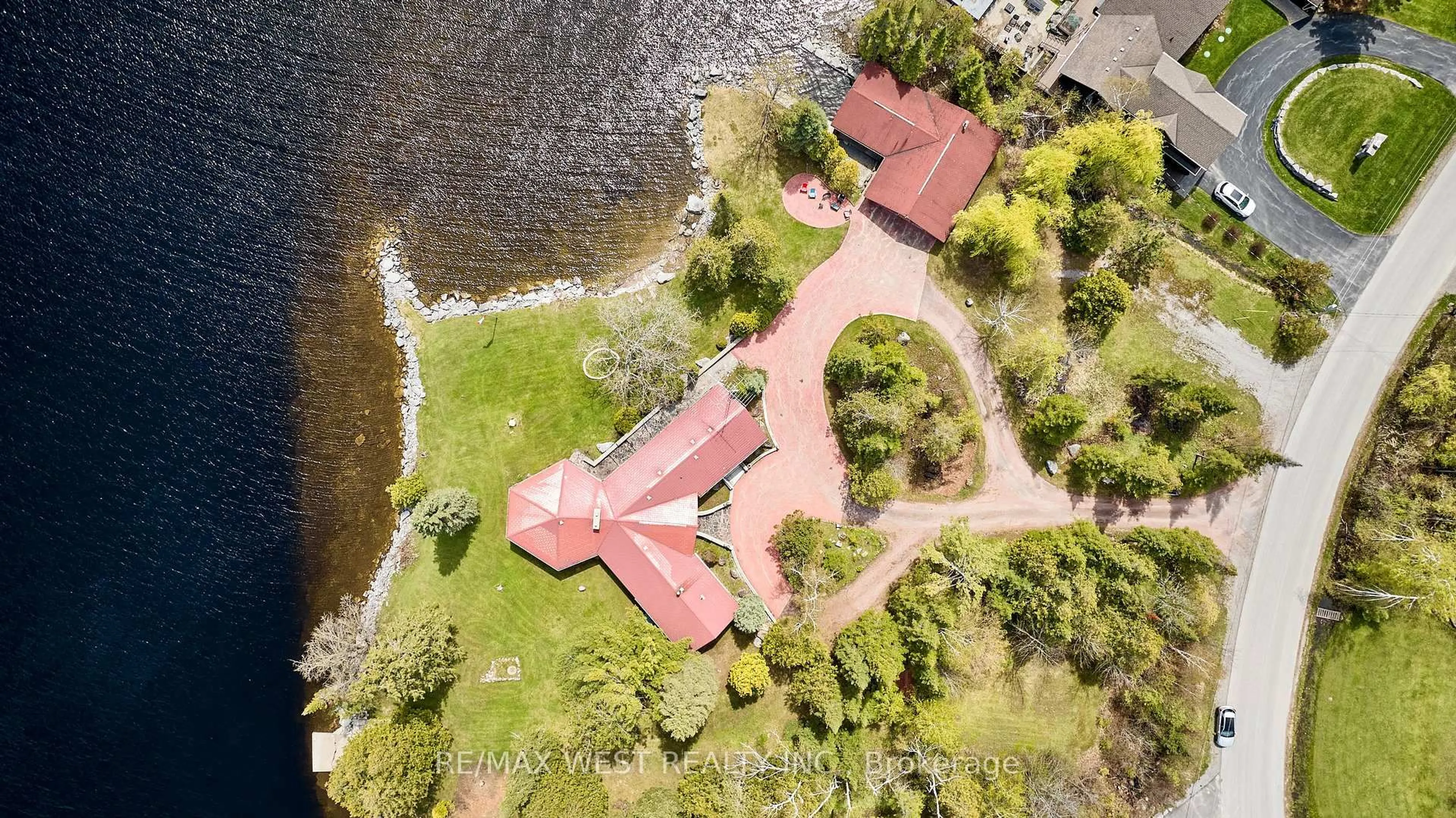 A pic from outside/outdoor area/front of a property/back of a property/a pic from drone, water/lake/river/ocean view for 557 Riverside Dr, Trent Lakes Ontario K9J 3Y9