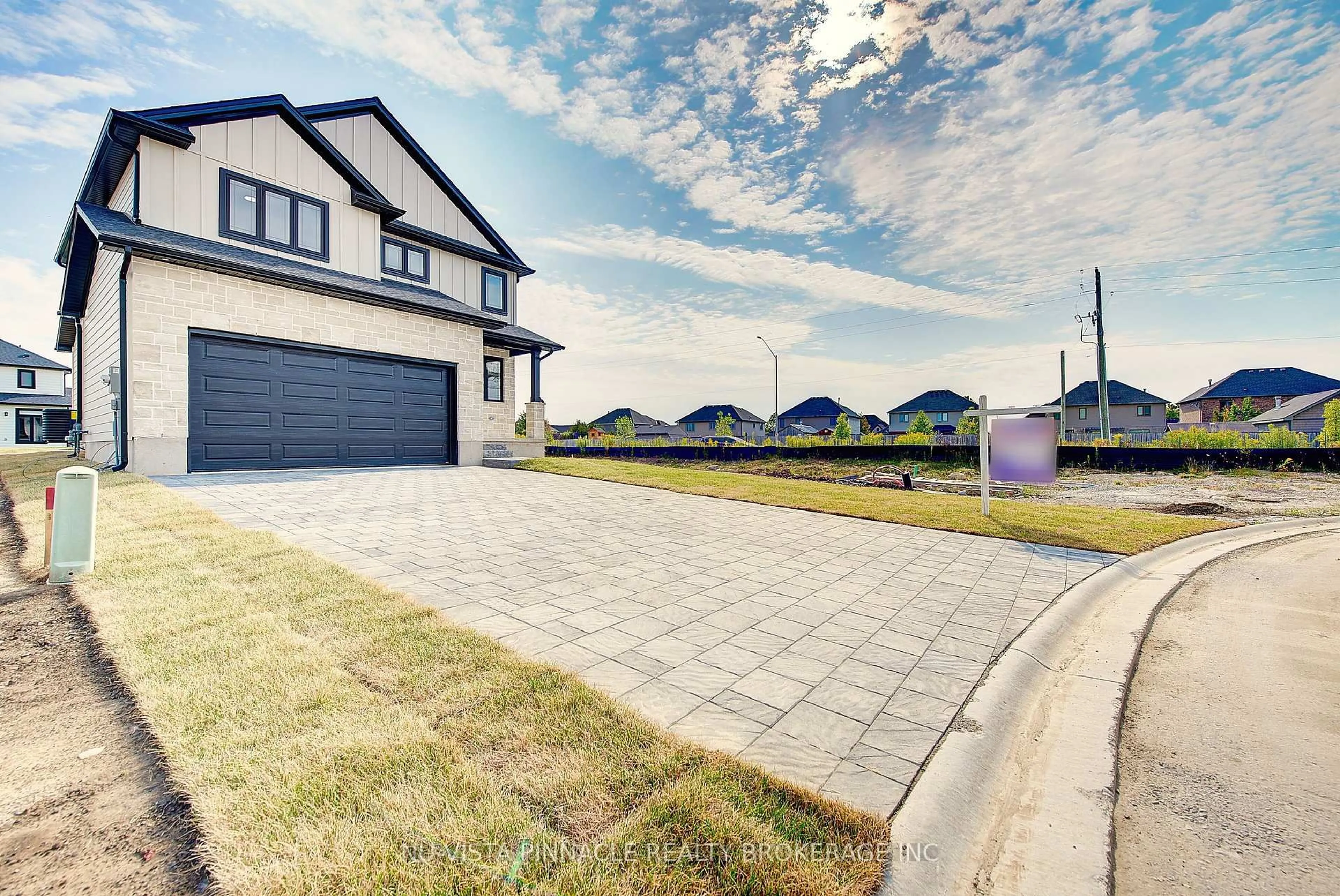 A pic from outside/outdoor area/front of a property/back of a property/a pic from drone, street for 10 Woodmere Path, Middlesex Centre Ontario N0M 2A0