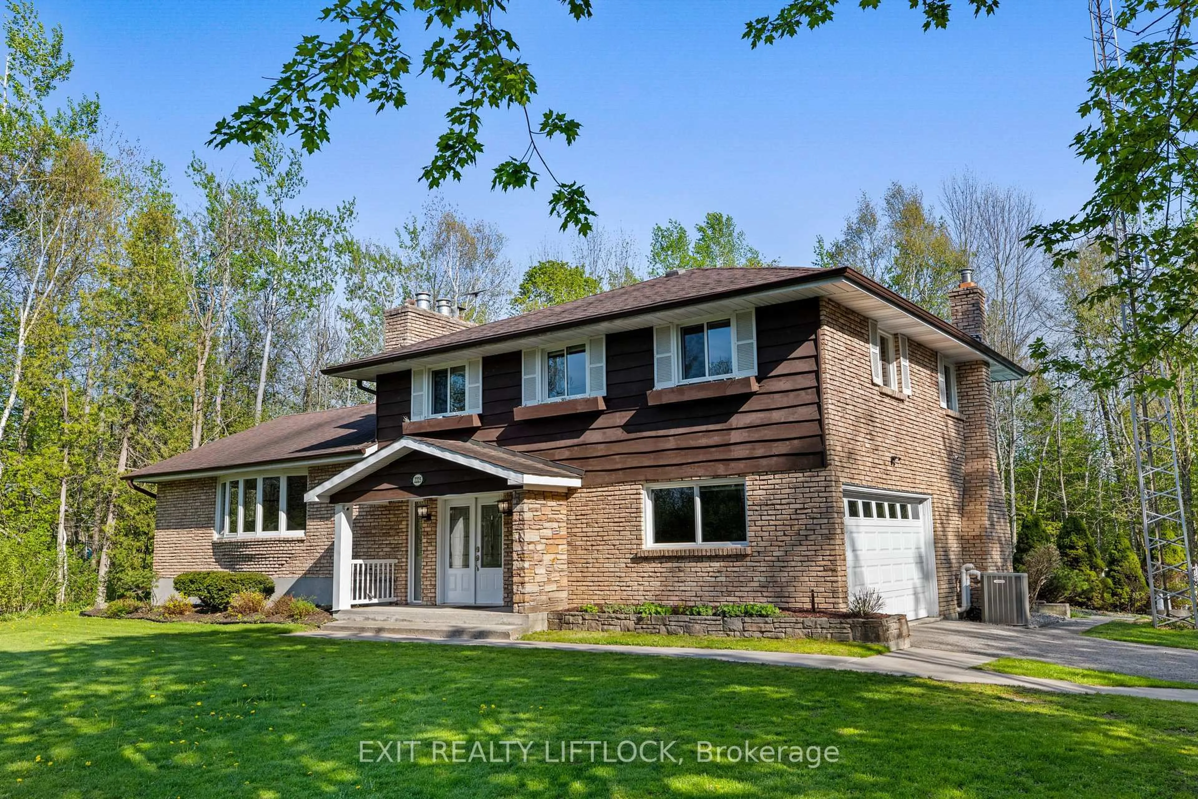 Home with brick exterior material, street for 2225 Parkhill Rd, Cavan Monaghan Ontario K9J 6X4