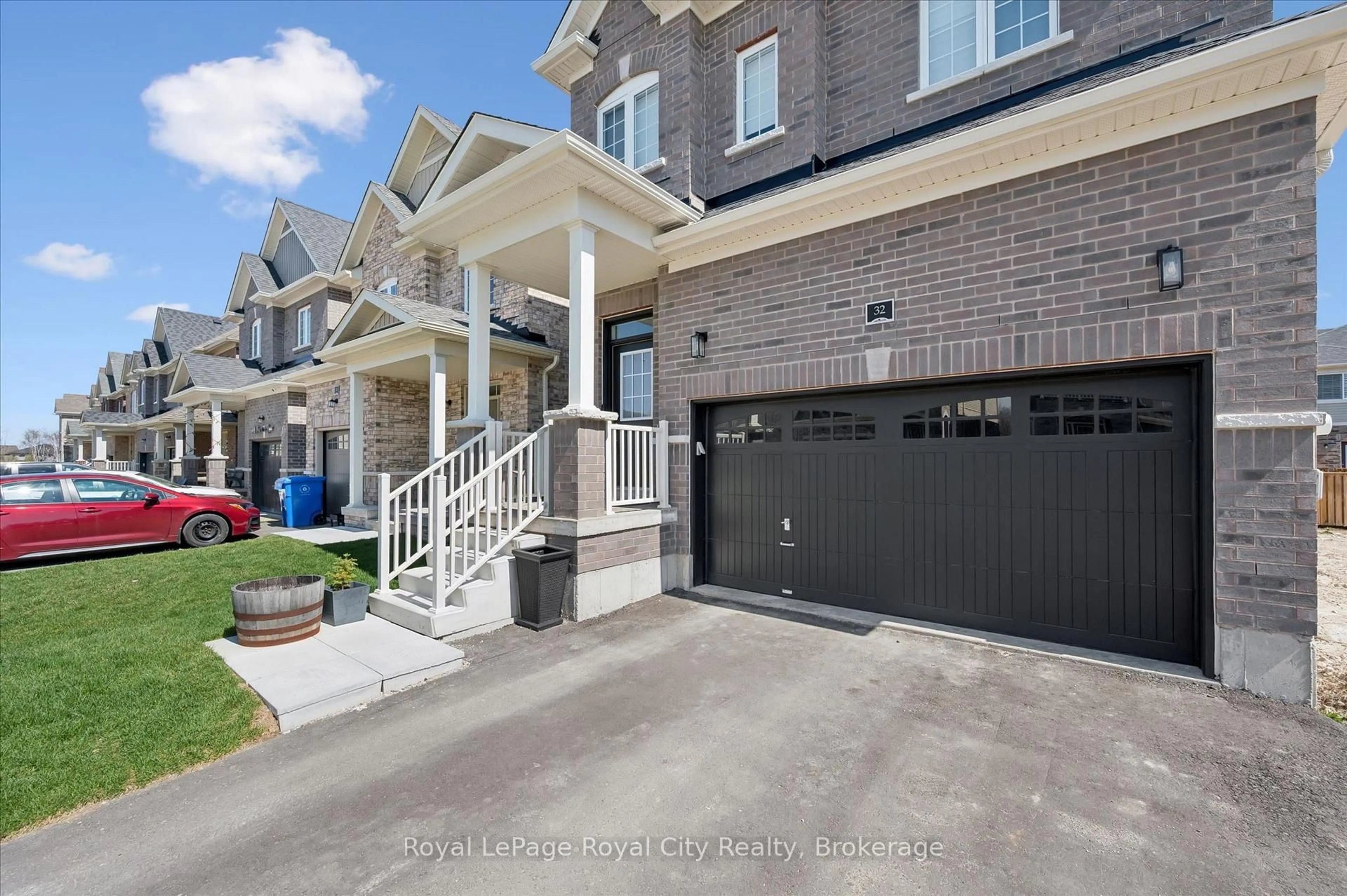 Home with brick exterior material, street for 32 Hutchison Rd, Guelph Ontario N1L 0R4