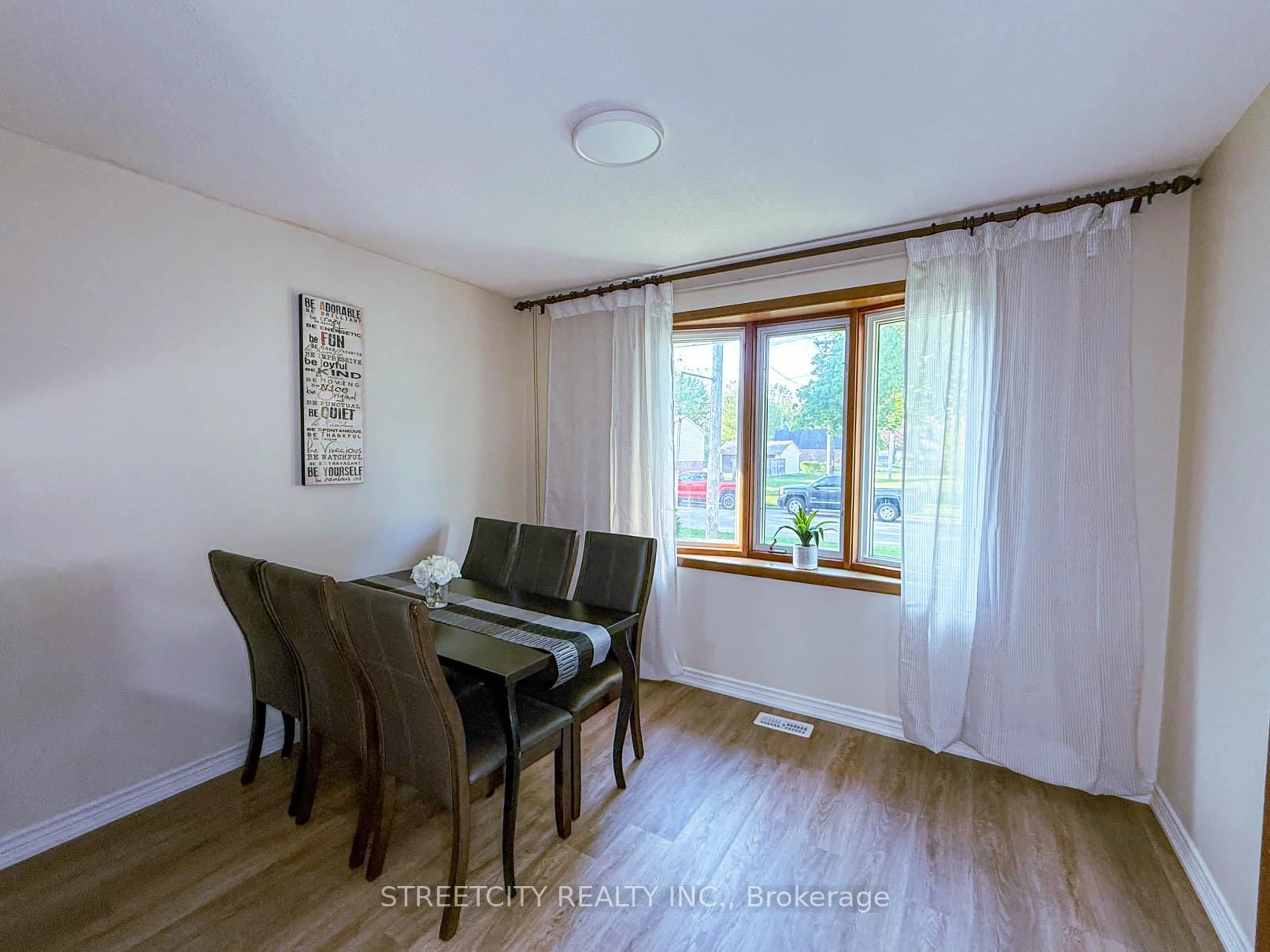 Dining room, wood/laminate floor for 785 Ross Ave, Sarnia Ontario N7T 7R1