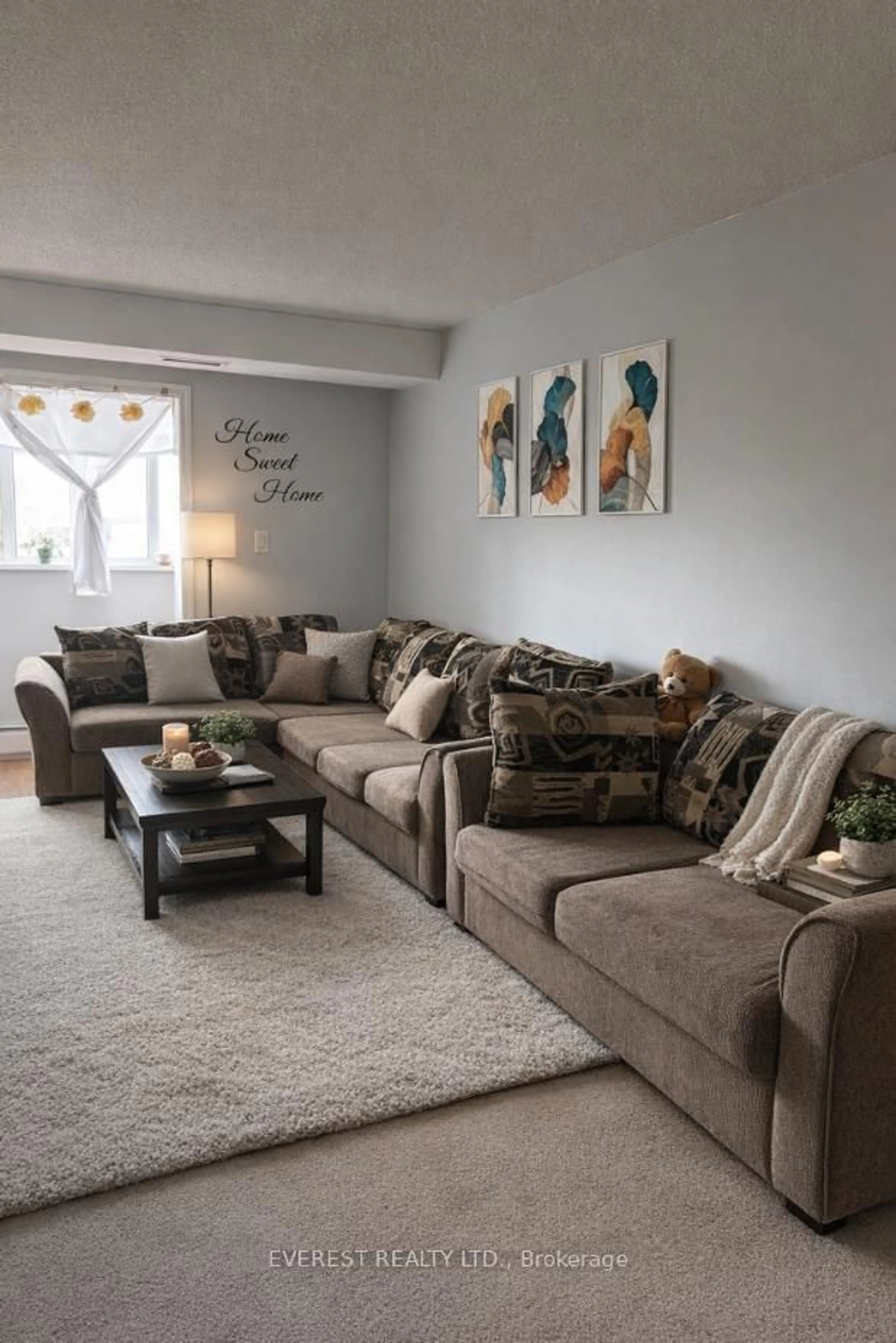 Living room with furniture, carpet floor for 276 Oakdale Ave #408, St. Catharines Ontario L2P 3S5