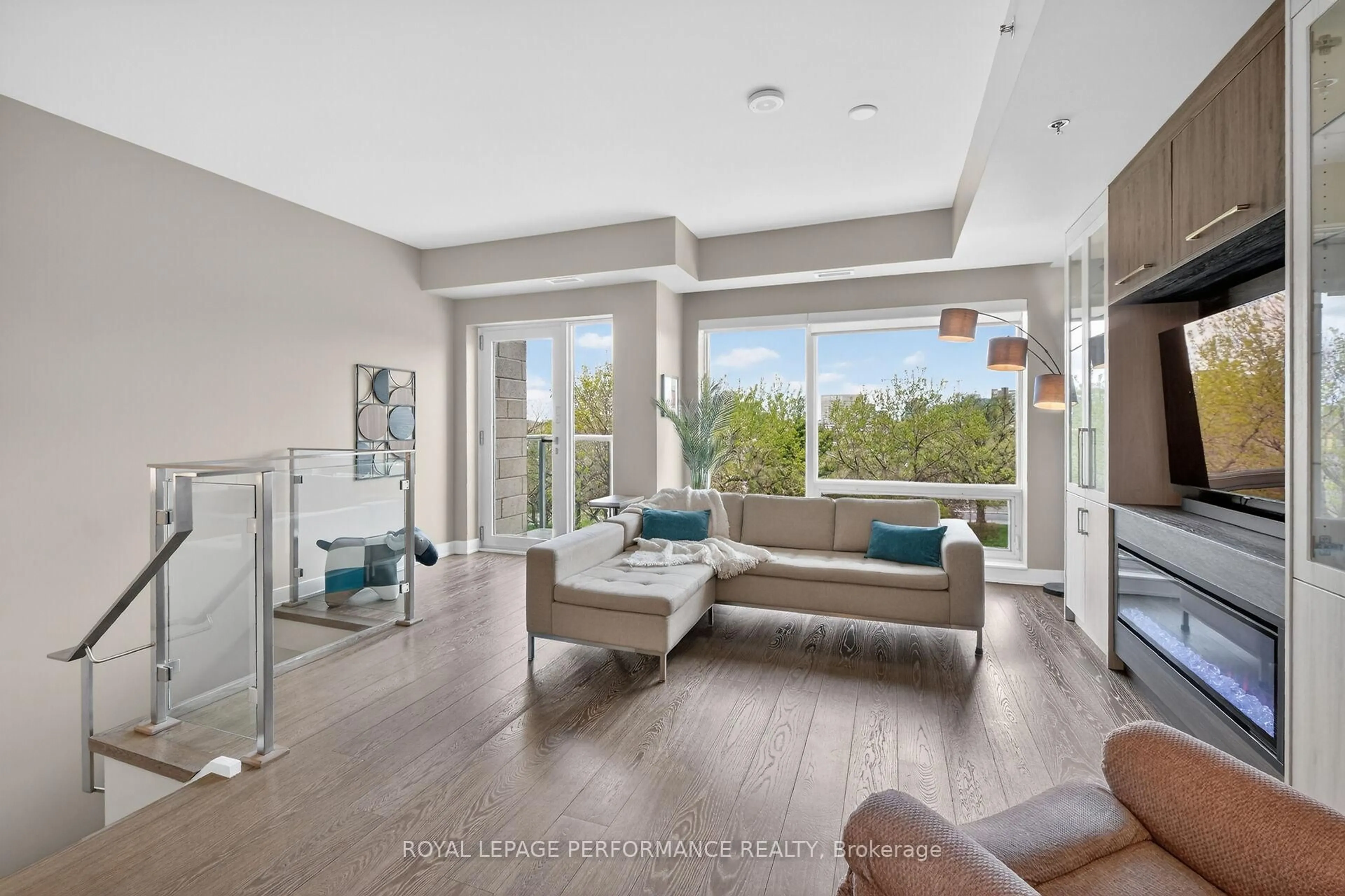 Living room with furniture, ceramic/tile floor for 416 Sparks St #110, Ottawa Ontario K1R 0B2