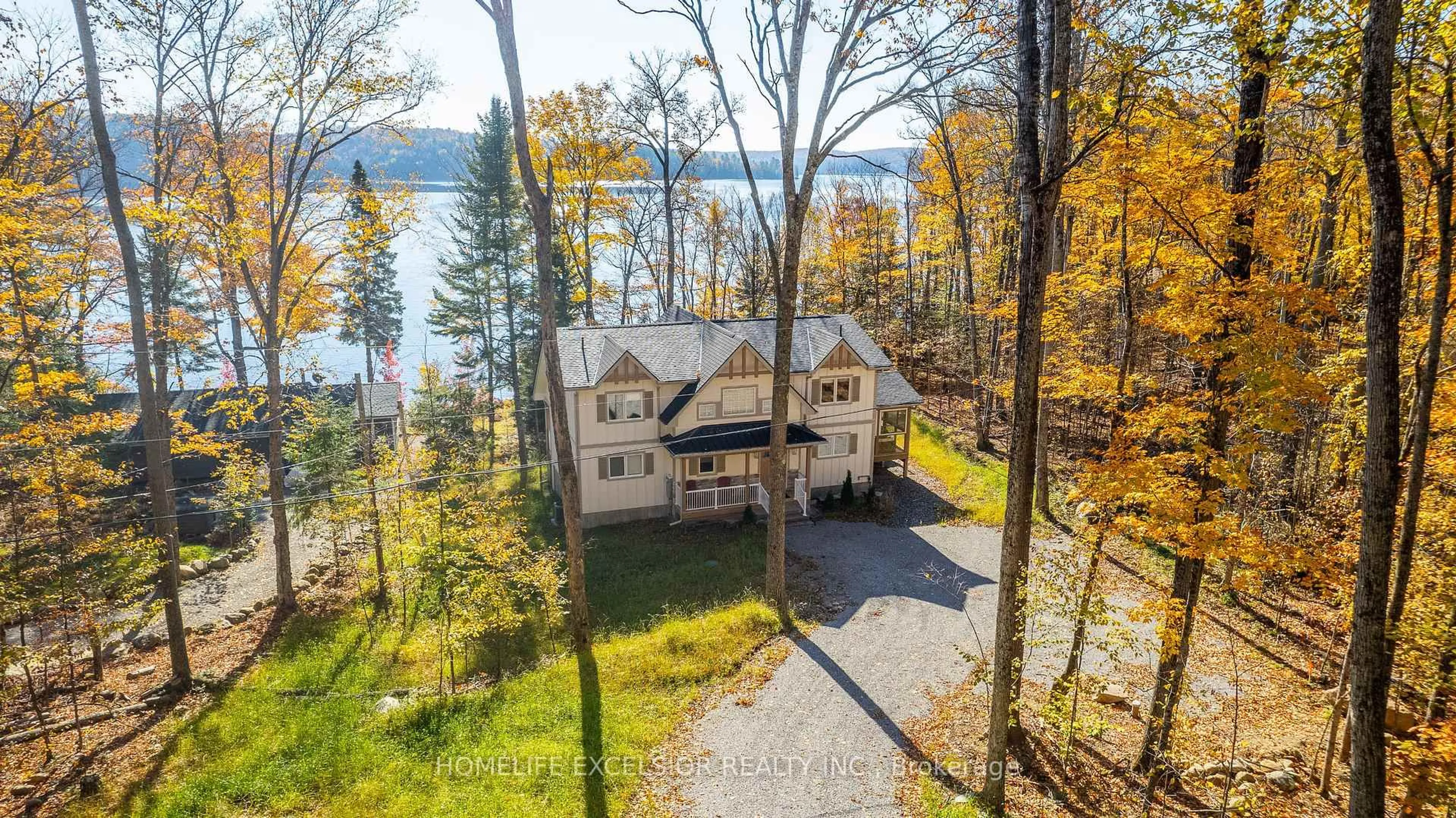 A pic from outside/outdoor area/front of a property/back of a property/a pic from drone, water/lake/river/ocean view for 1284 True North Rd, Dysart et al Ontario K0M 2T0