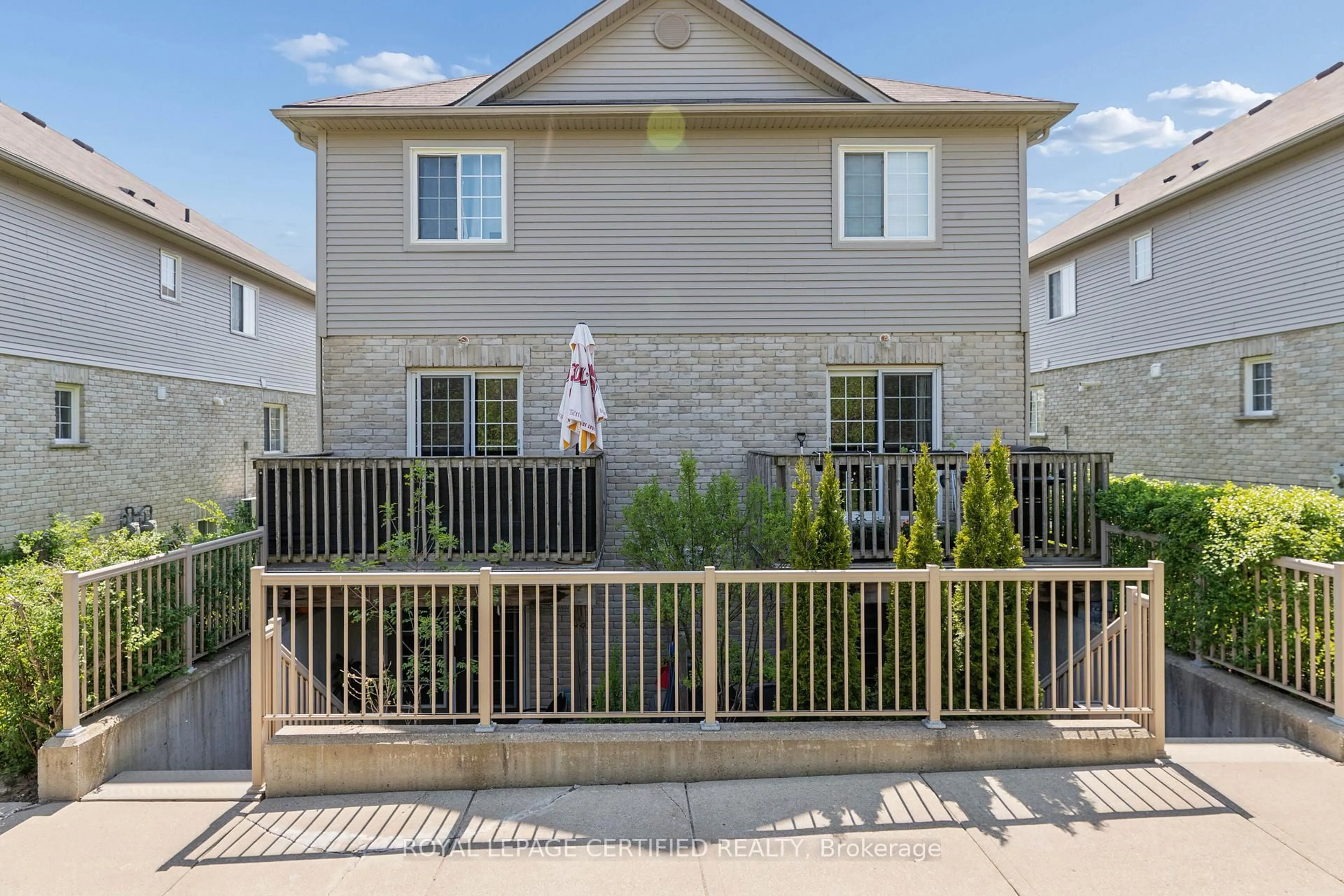 Home with vinyl exterior material, street for 35 Mountford Dr #60, Guelph Ontario N1E 0G6