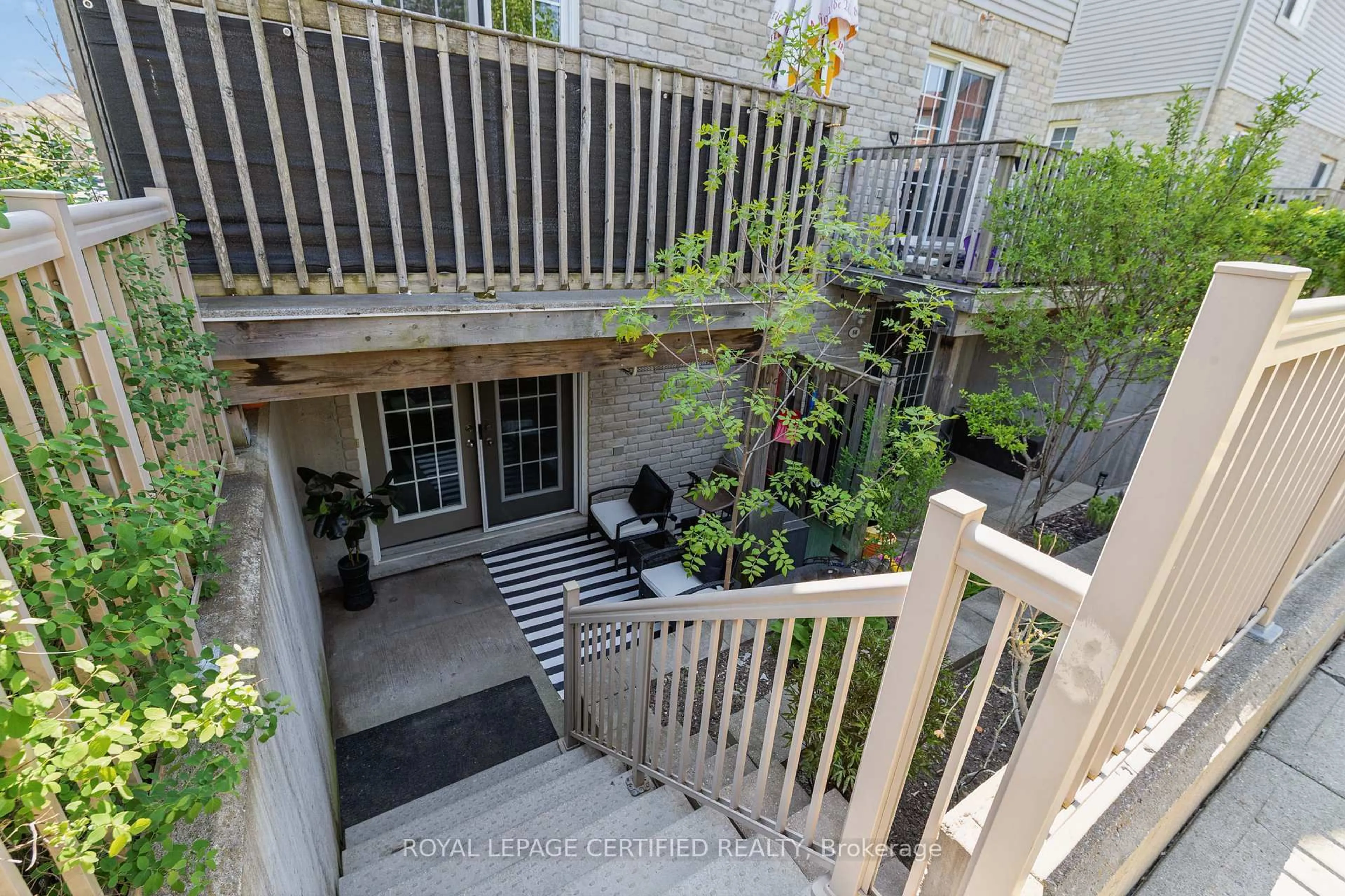 Patio, city buildings view from balcony for 35 Mountford Dr #60, Guelph Ontario N1E 0G6