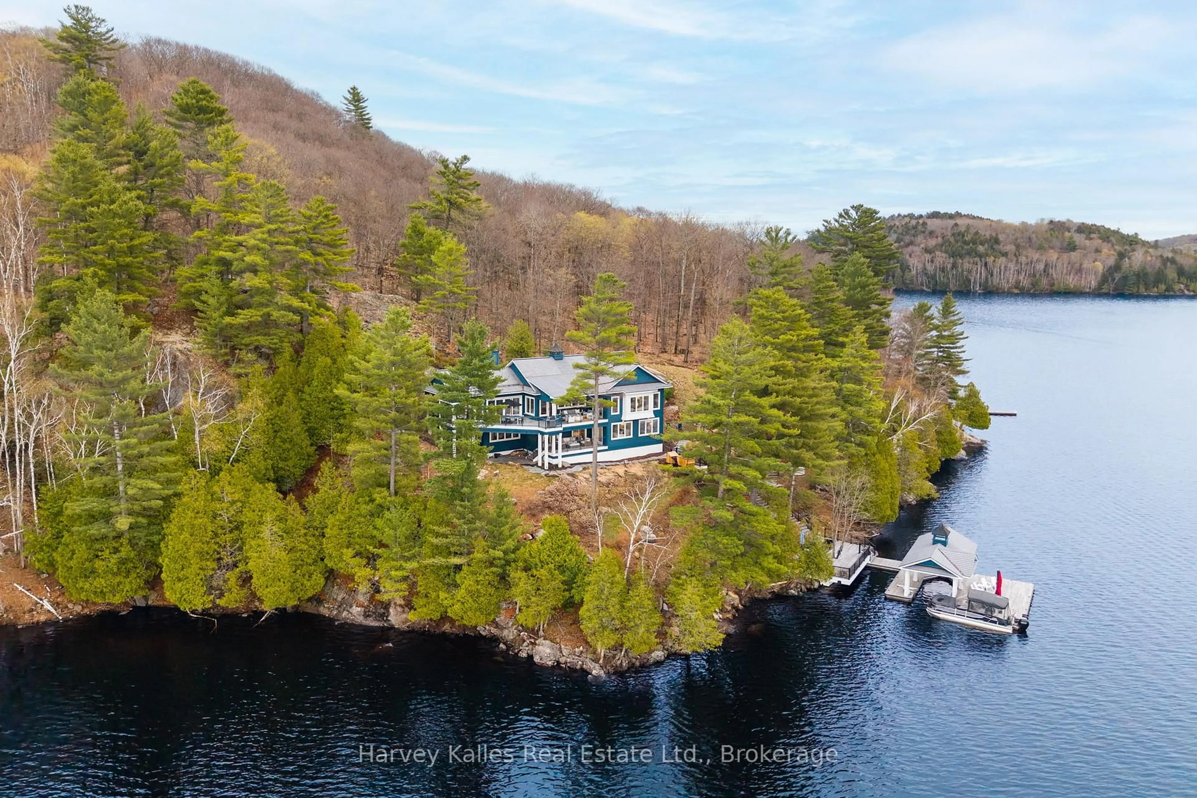 A pic from outside/outdoor area/front of a property/back of a property/a pic from drone, water/lake/river/ocean view for 800 Big Island, Huntsville Ontario P1H 2J2