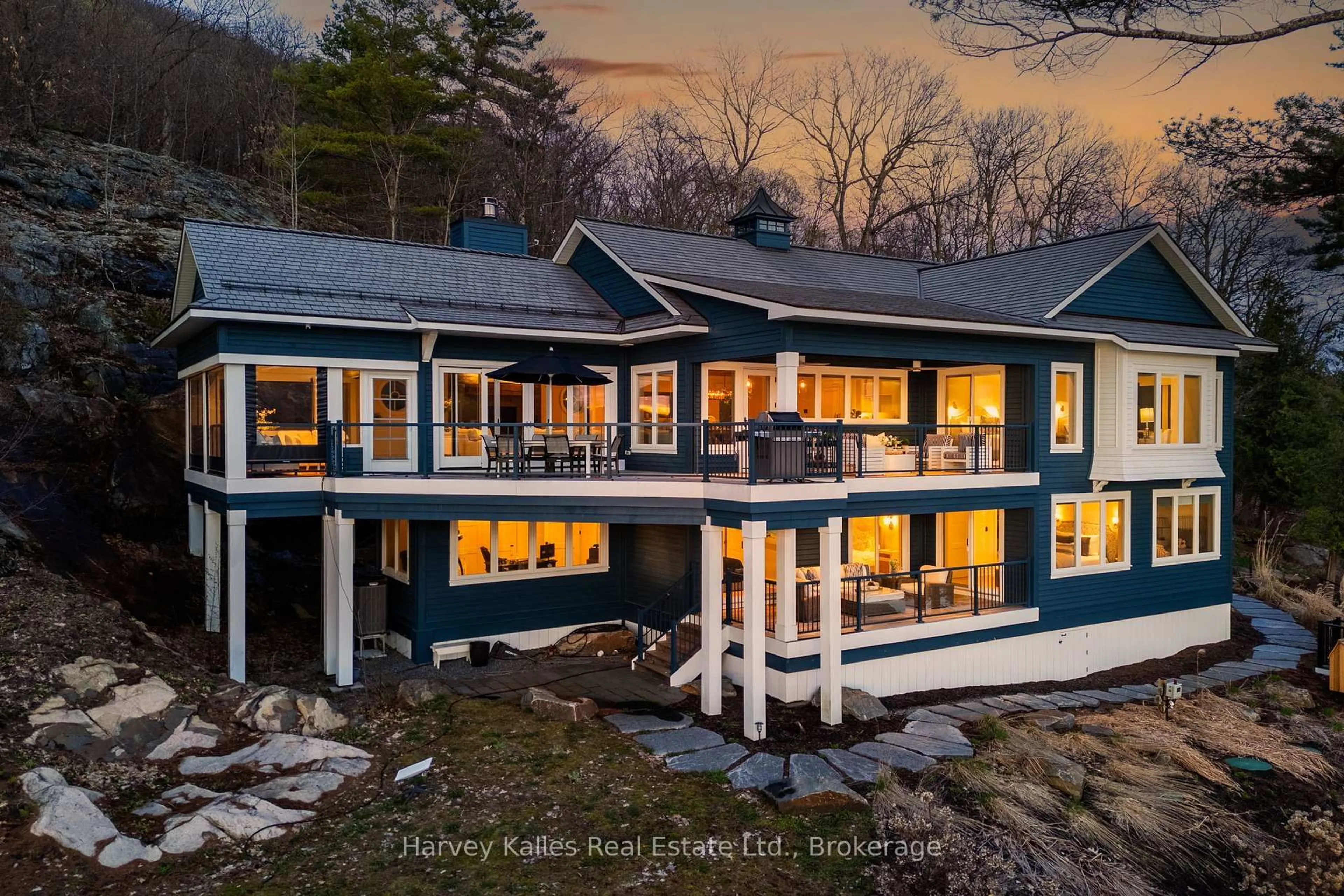 A pic from outside/outdoor area/front of a property/back of a property/a pic from drone, water/lake/river/ocean view for 800 Big Island, Huntsville Ontario P1H 2J2