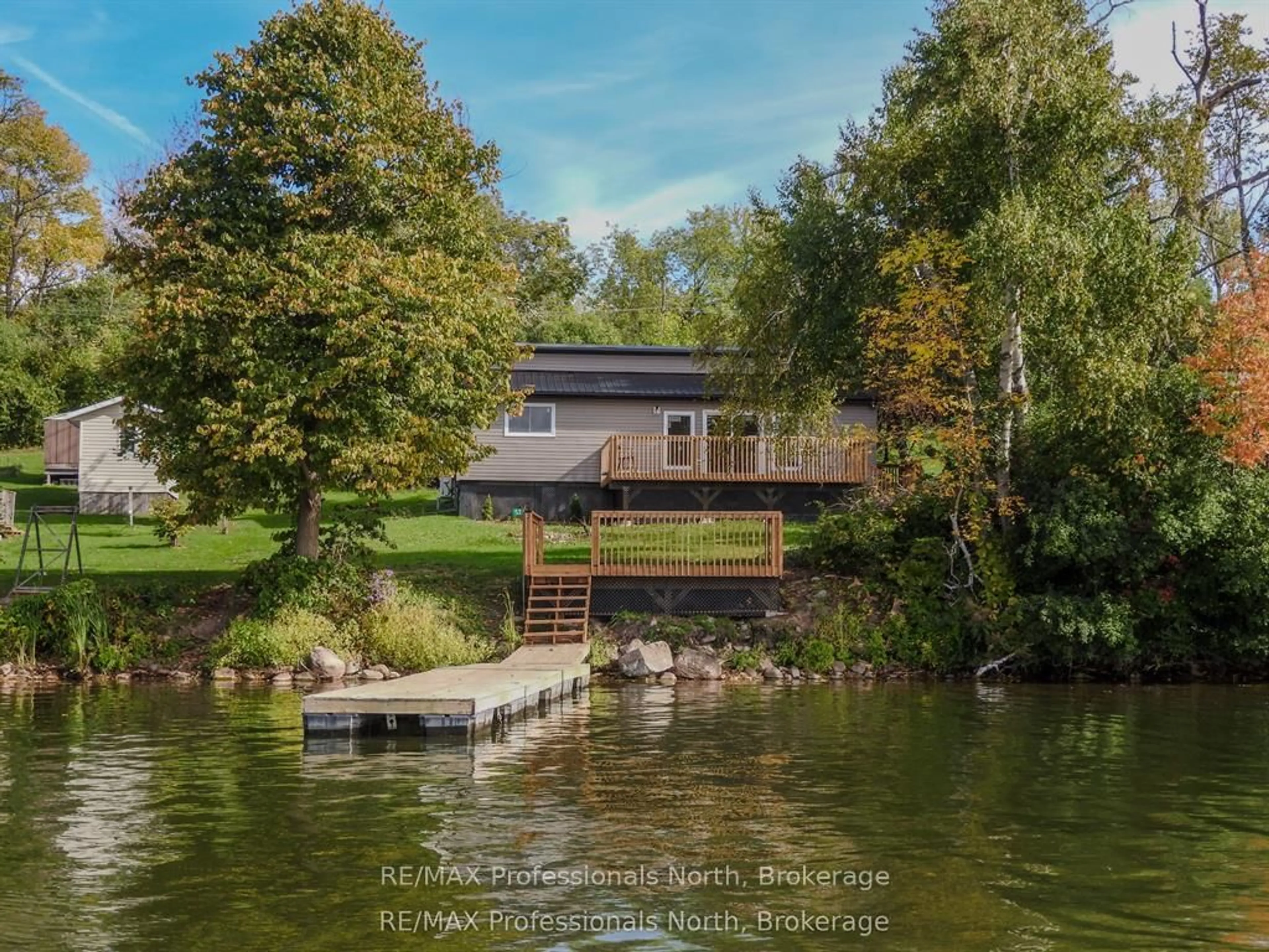 A pic from outside/outdoor area/front of a property/back of a property/a pic from drone, water/lake/river/ocean view for 53 Long Island, Otonabee-South Monaghan Ontario K0L 1B0