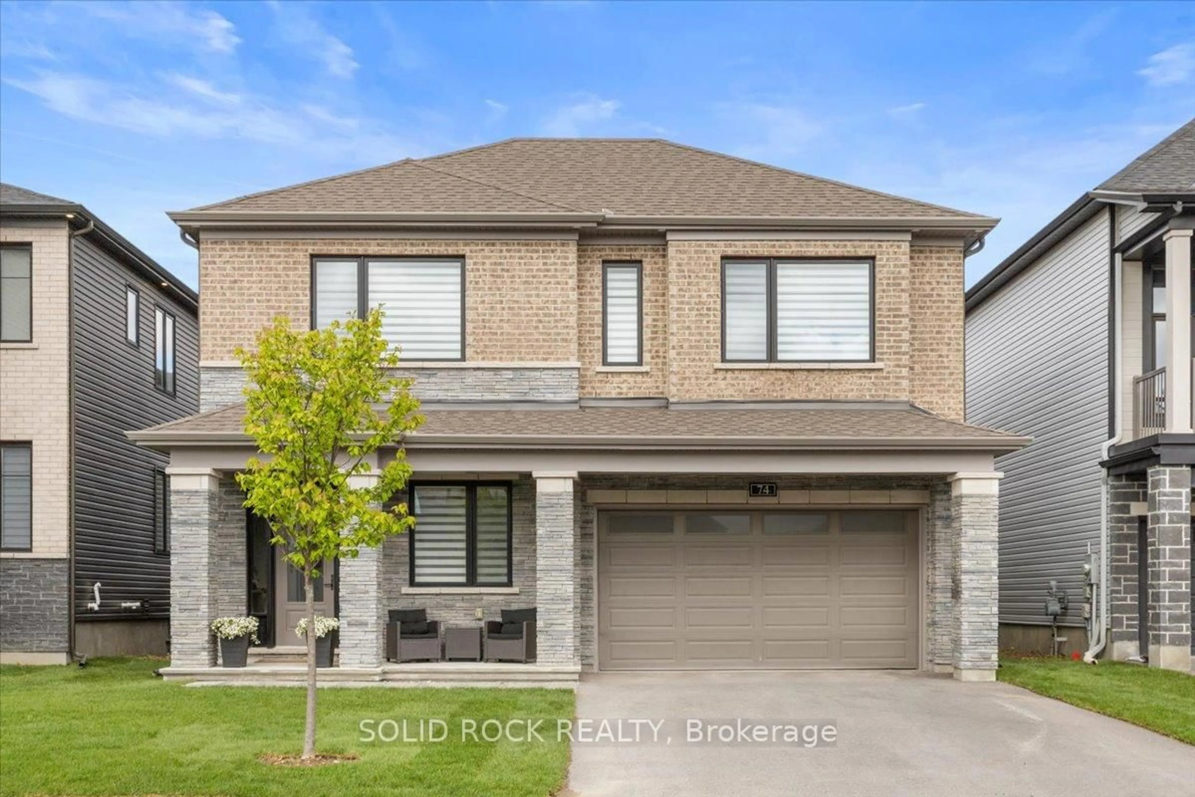 Home with brick exterior material, street for 74 Ascari Rd, Manotick Ontario K4M 0A5