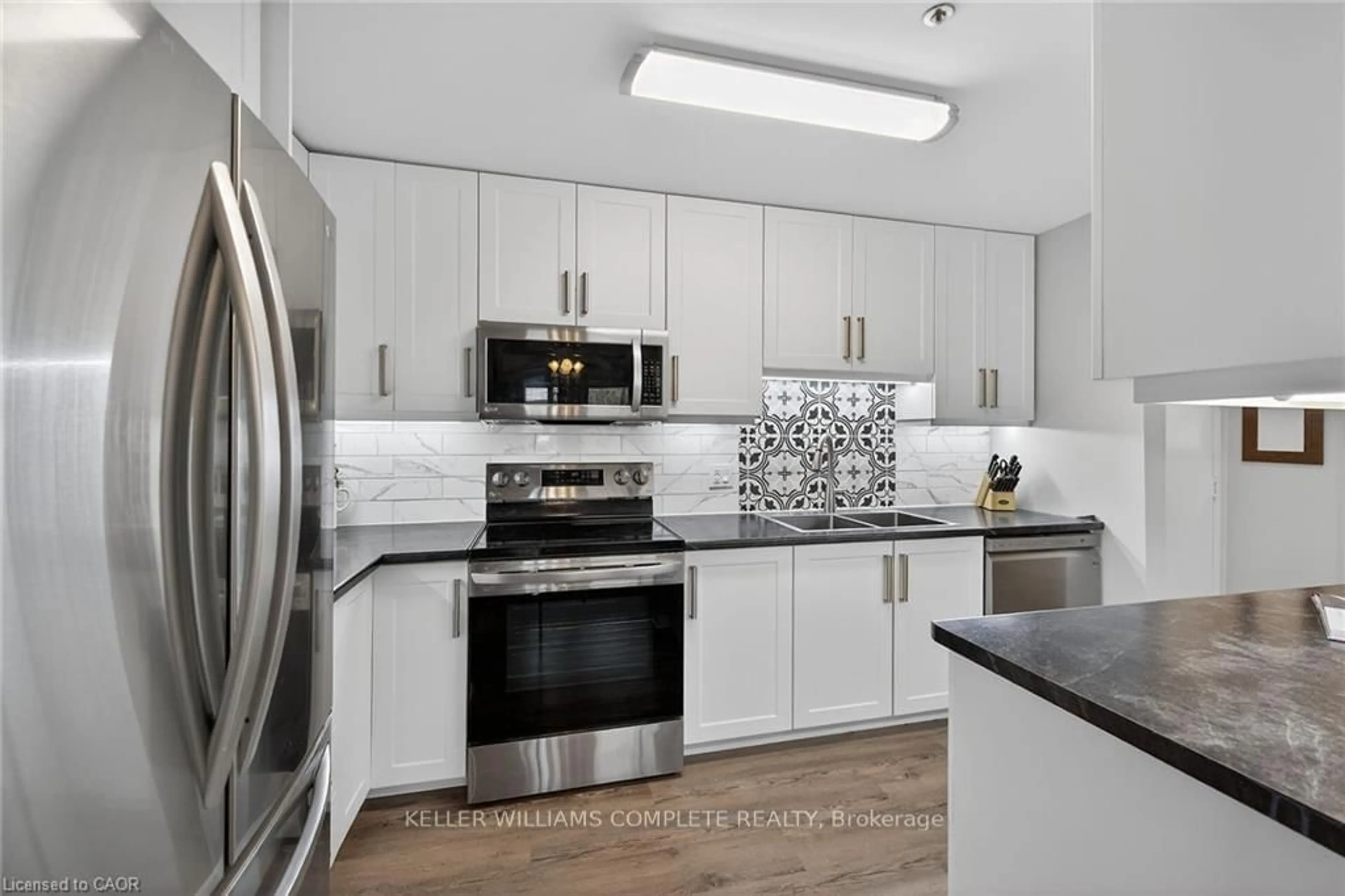 Open concept kitchen, ceramic/tile floor for 6 NIAGARA St #208, Grimsby Ontario L3M 5A4