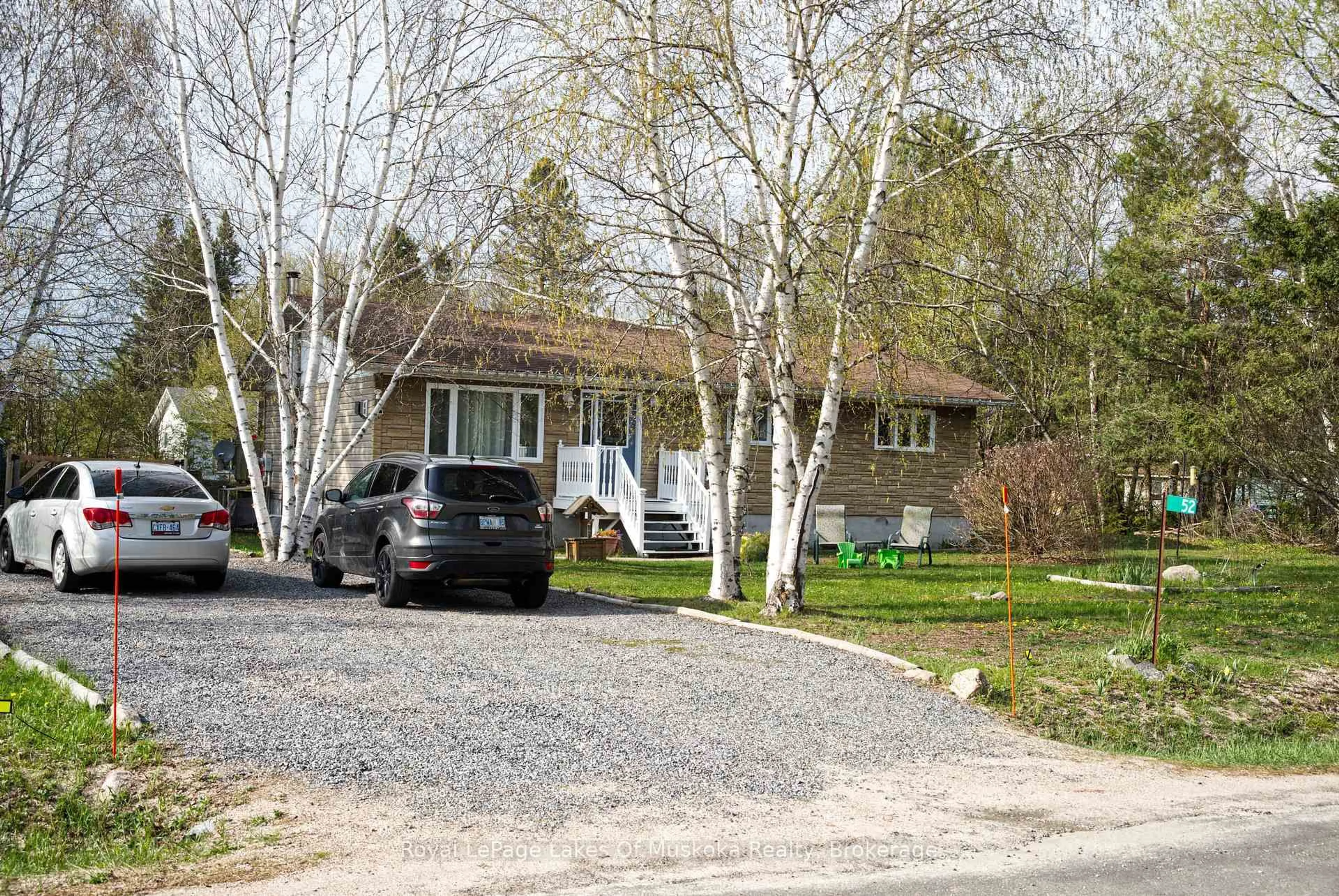 A pic from outside/outdoor area/front of a property/back of a property/a pic from drone, street for 52 Sunshine St, South River Ontario P0A 1Z0