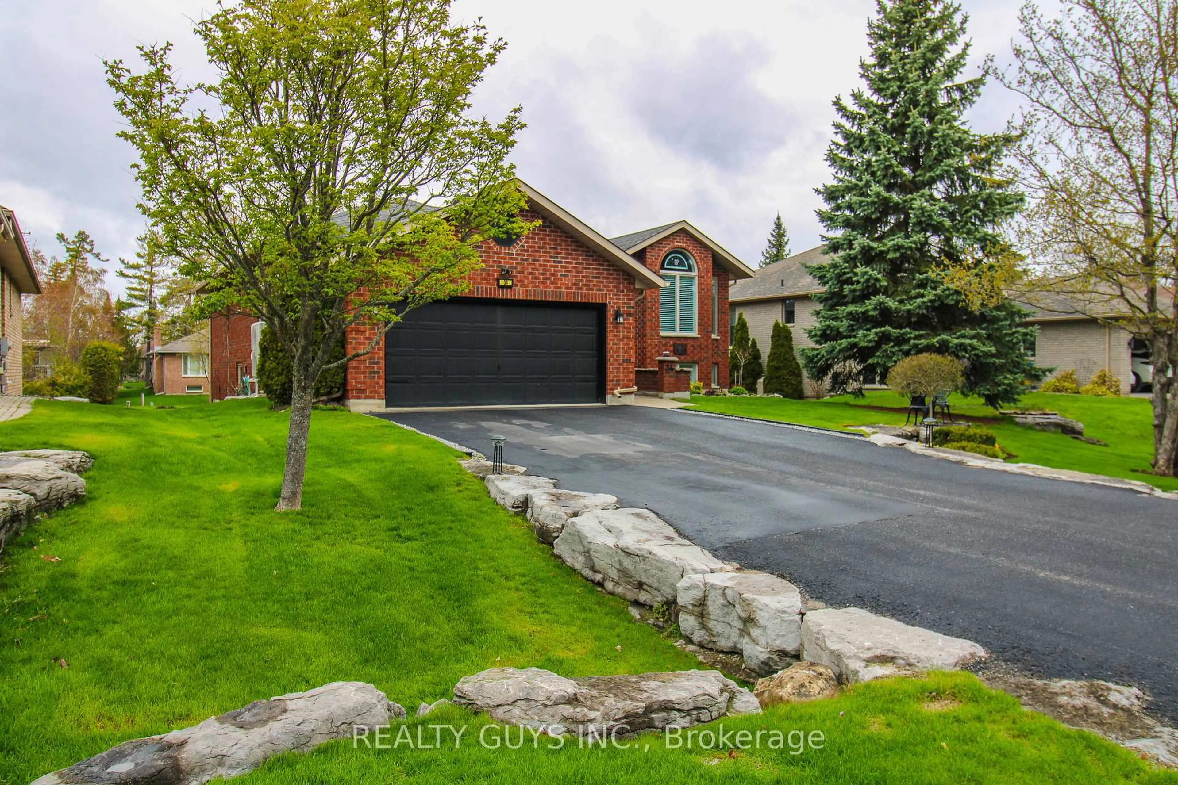 Home with brick exterior material, street for 34 Olde Forest Lane, Kawartha Lakes Ontario K0M 1A0