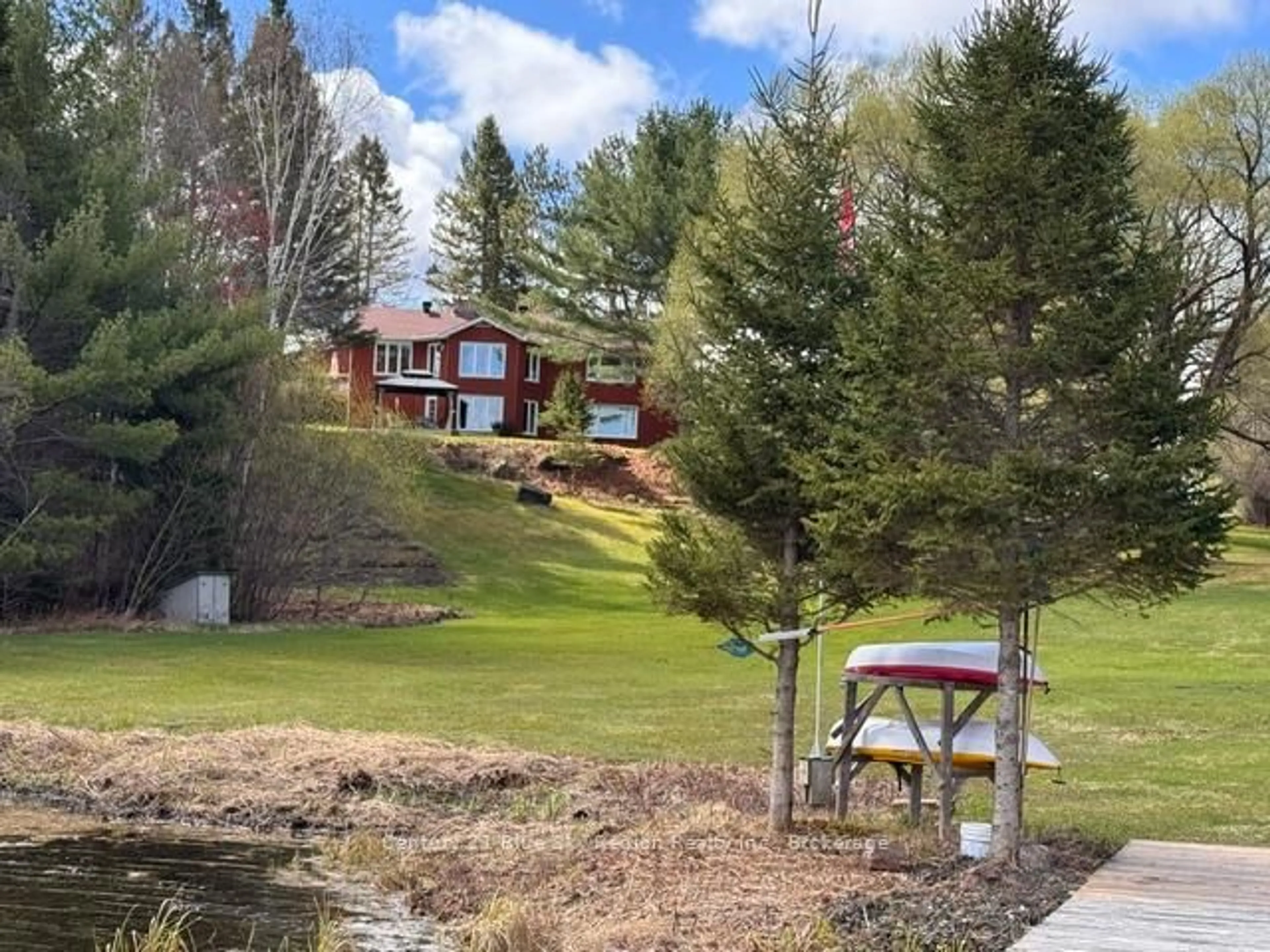 A pic from outside/outdoor area/front of a property/back of a property/a pic from drone, water/lake/river/ocean view for 353 Macpherson Dr, East Ferris Ontario P0H 1K0