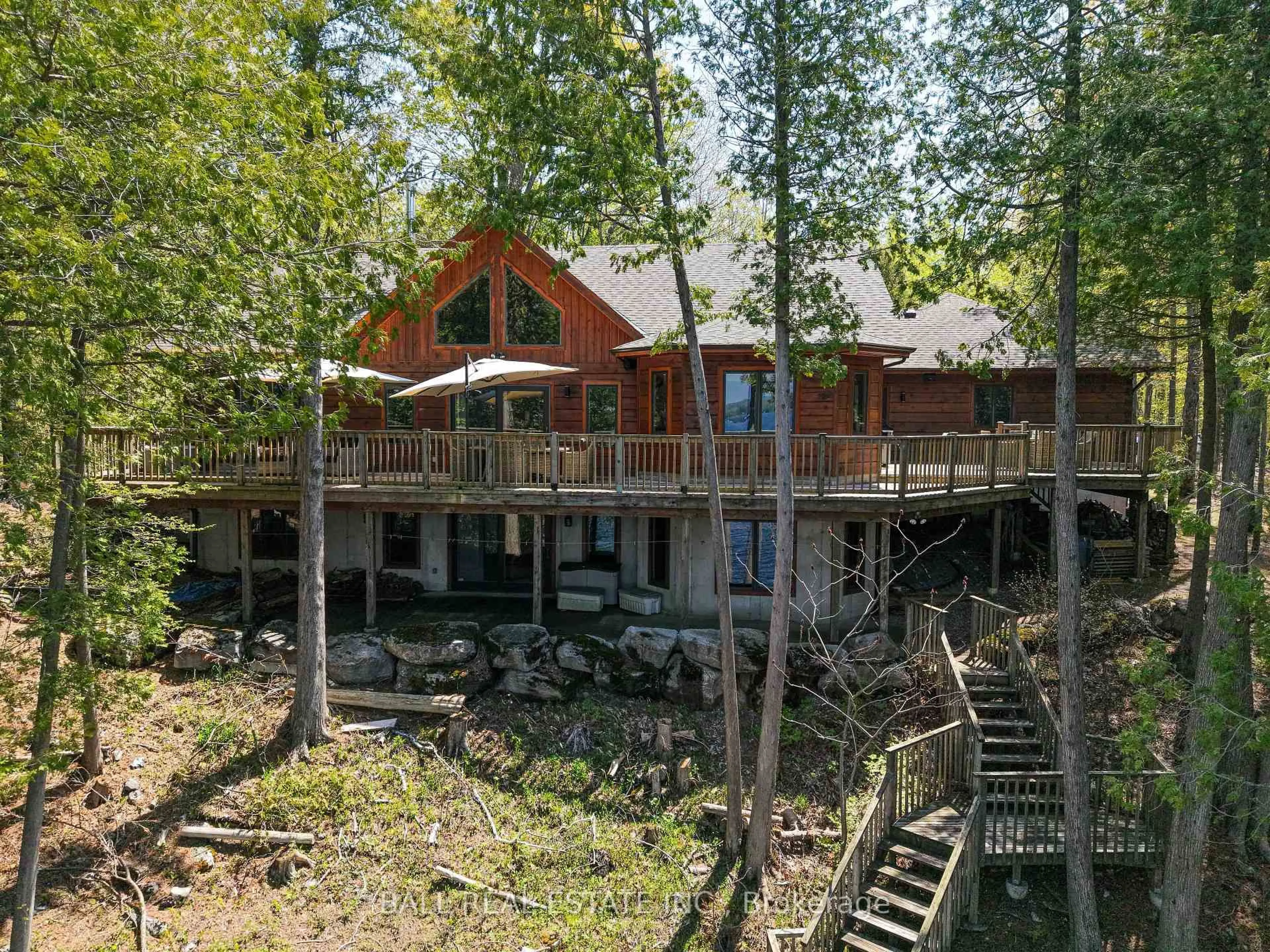 A pic from outside/outdoor area/front of a property/back of a property/a pic from drone, forest/trees view for 61 Ted's Lane, Trent Lakes Ontario K0L 1J0