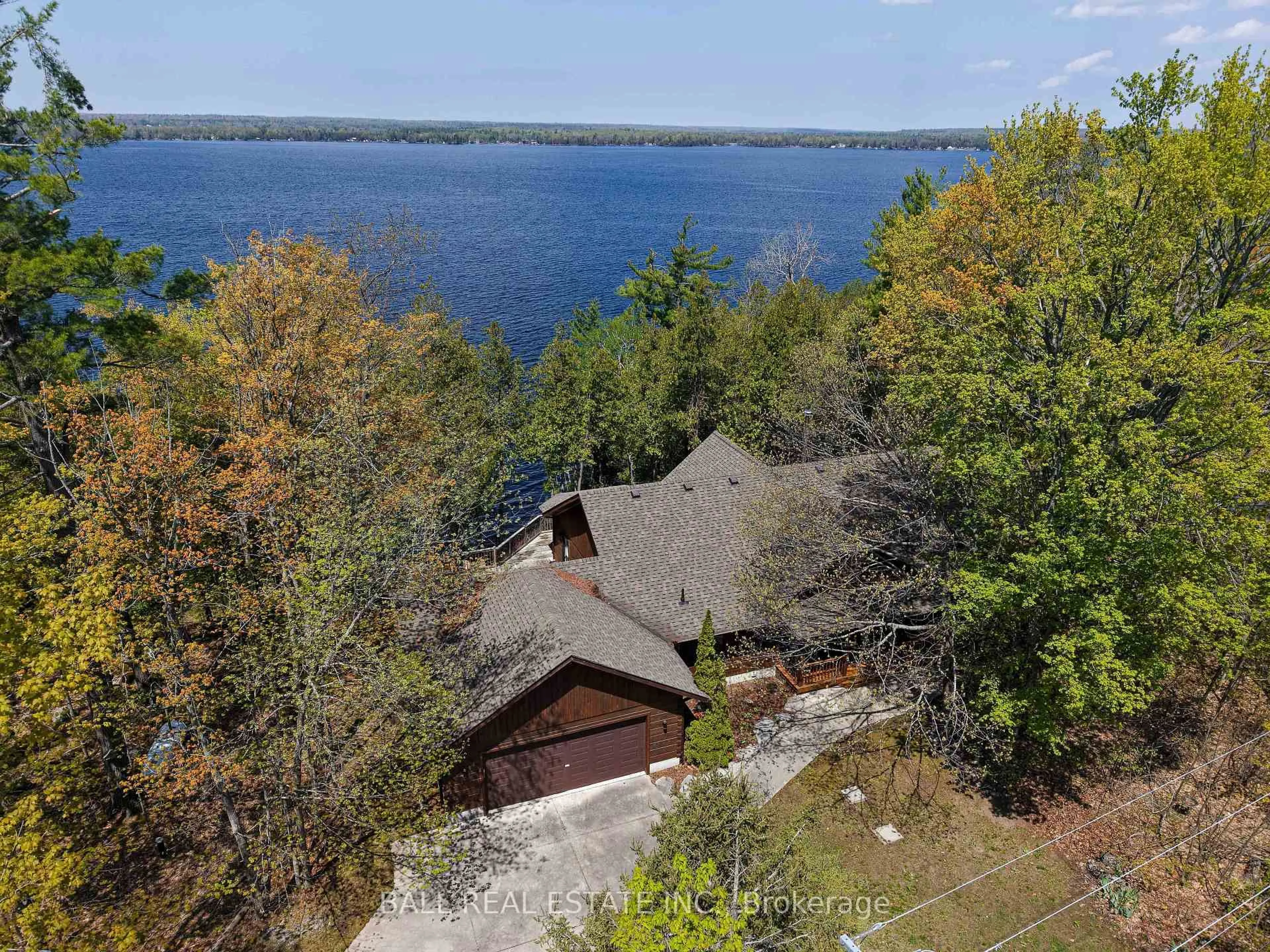 A pic from outside/outdoor area/front of a property/back of a property/a pic from drone, water/lake/river/ocean view for 61 Ted's Lane, Trent Lakes Ontario K0L 1J0