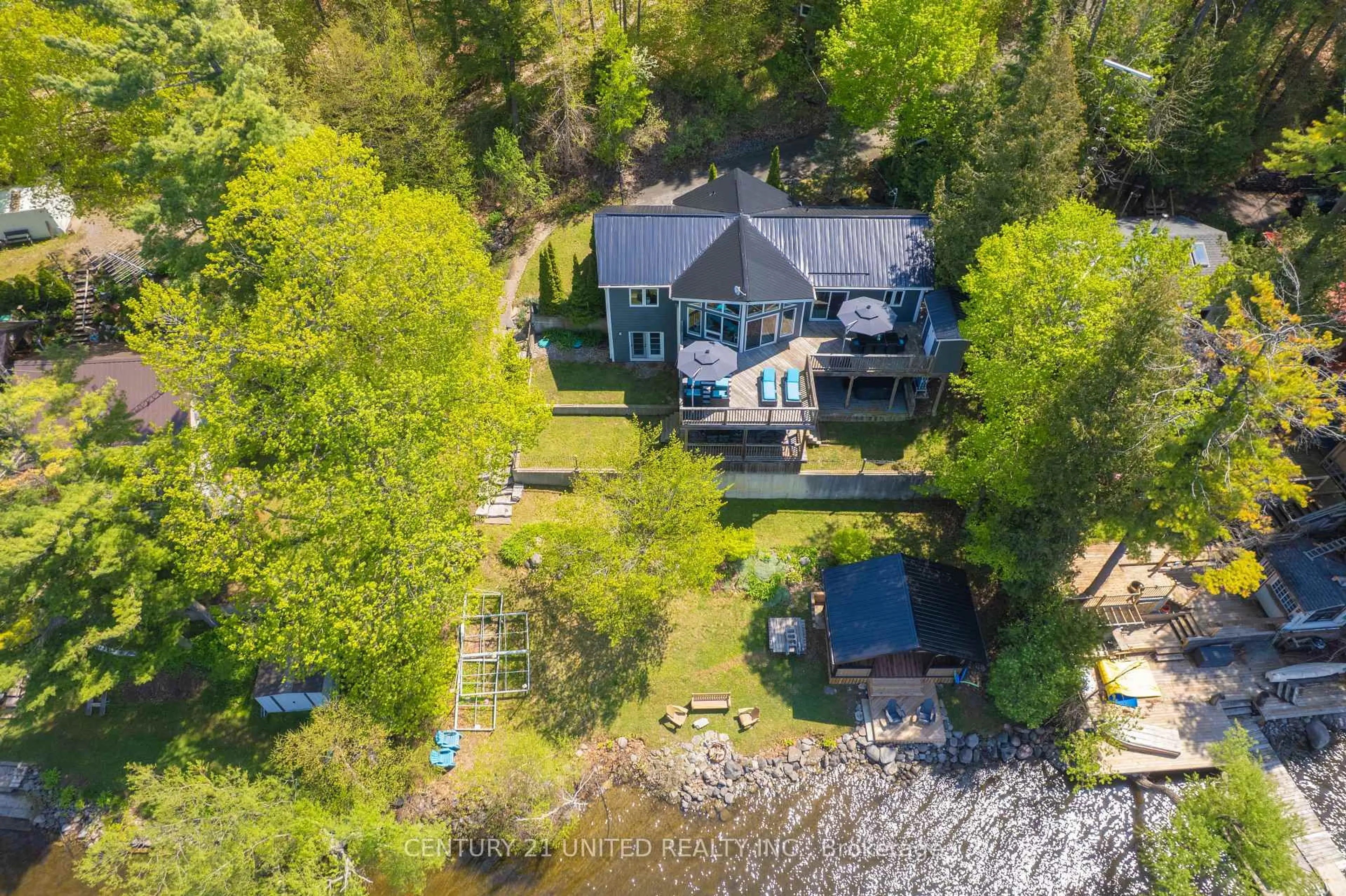 A pic from outside/outdoor area/front of a property/back of a property/a pic from drone, water/lake/river/ocean view for 64 Sunnybrae Lane, Trent Hills Ontario K0L 1Y0