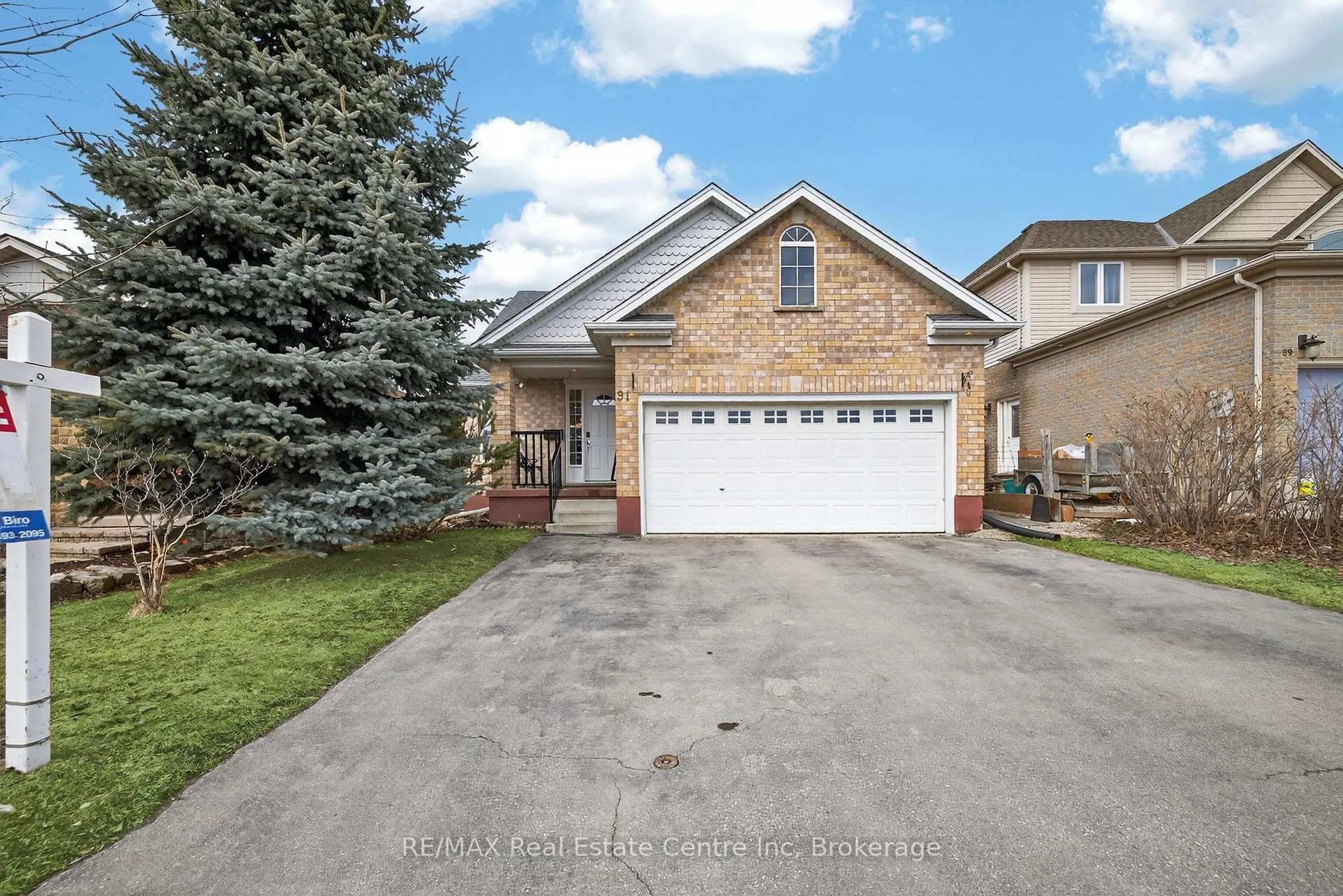 Home with brick exterior material, street for 91 Flaherty Dr, Guelph Ontario N1K 1Y7
