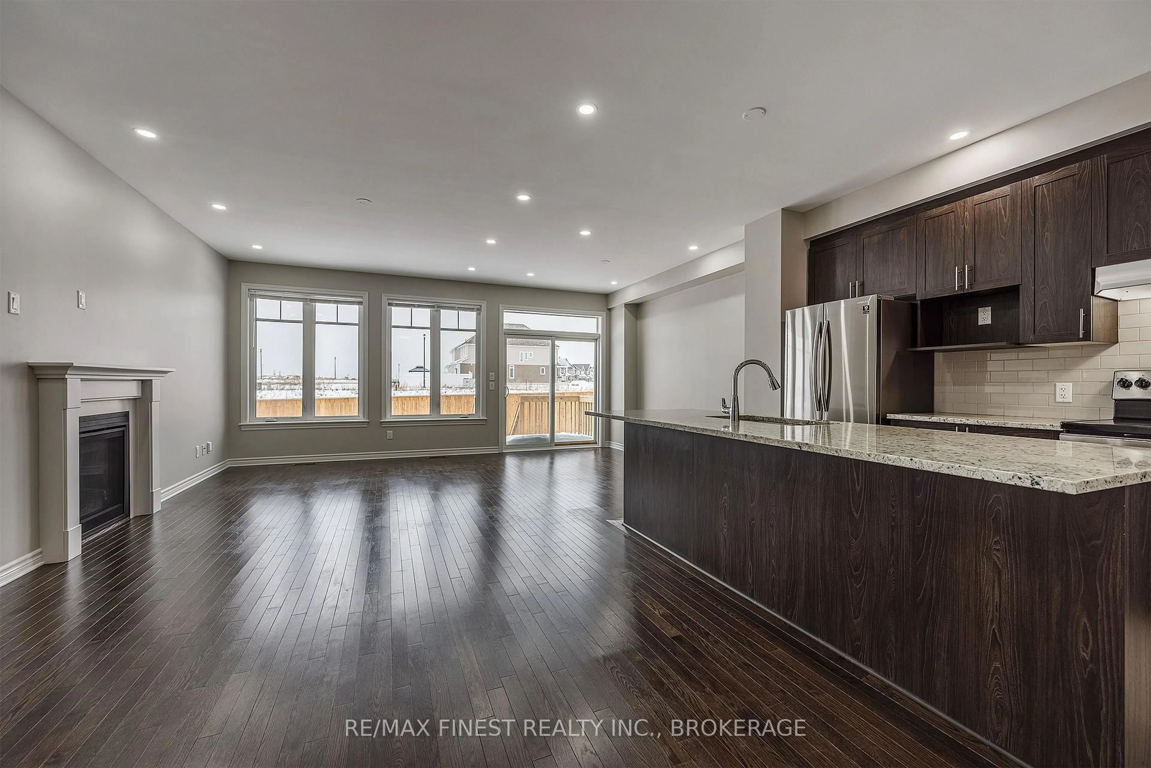 Open concept kitchen, wood/laminate floor for 1113 Barrow Ave, Kingston Ontario K7M 0G4