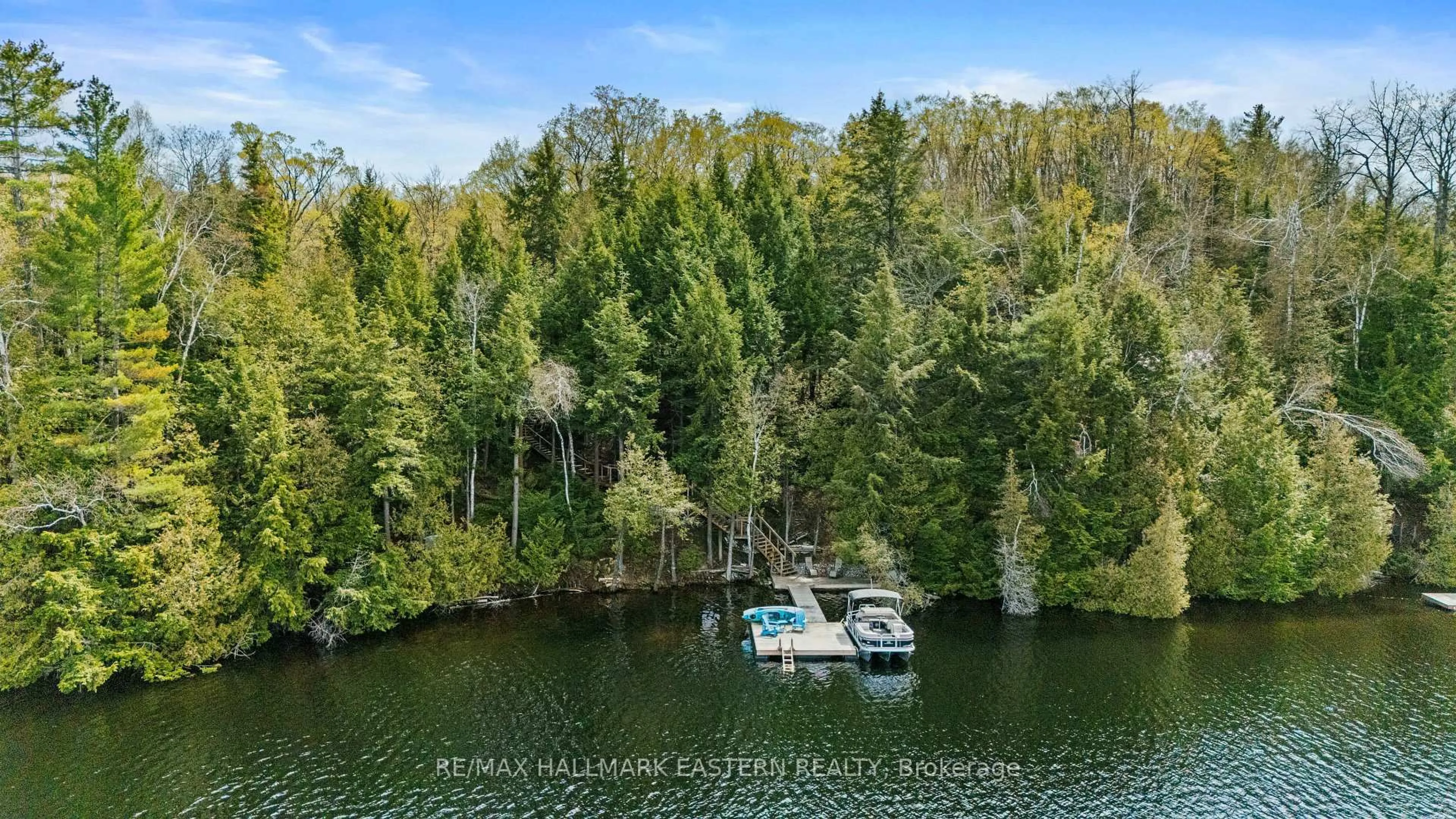 A pic from outside/outdoor area/front of a property/back of a property/a pic from drone, water/lake/river/ocean view for 50 Fire Route 328A, Trent Lakes Ontario K0L 1J0