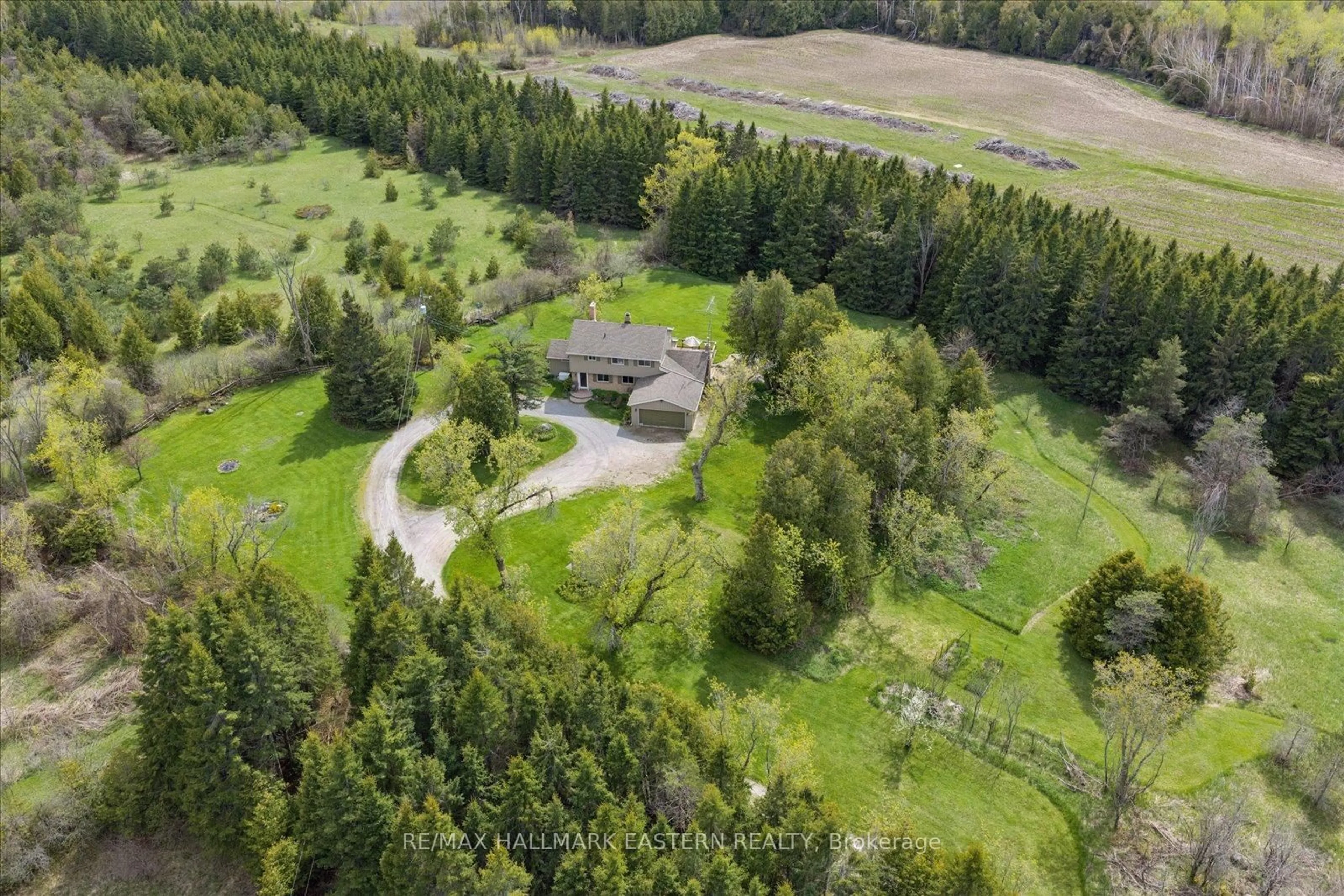 A pic from outside/outdoor area/front of a property/back of a property/a pic from drone, forest/trees view for 906 Mount Horeb Rd, Kawartha Lakes Ontario K0L 2W0