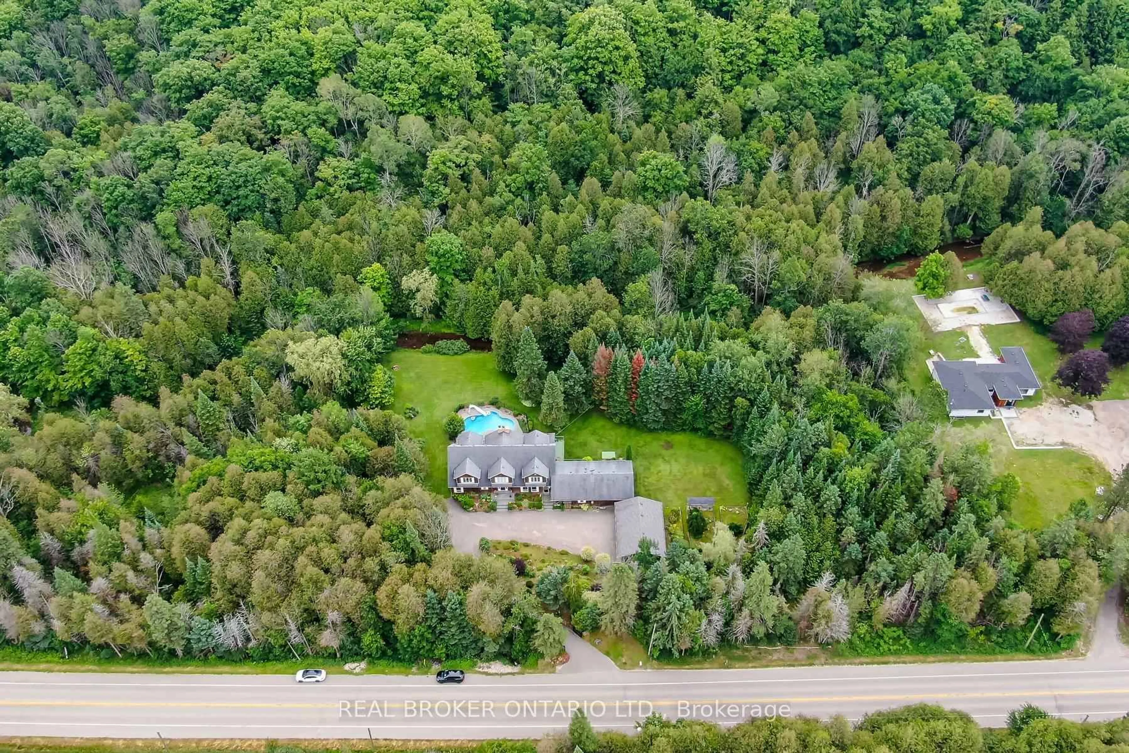 A pic from outside/outdoor area/front of a property/back of a property/a pic from drone, forest/trees view for 307254 Hockley Rd, Mono Ontario L9W 2Y8